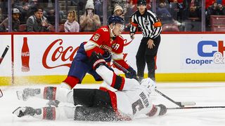 Ottawa Senators player Nick Holden drops down to defend Florida Panthers player Matthew Tkachuk.