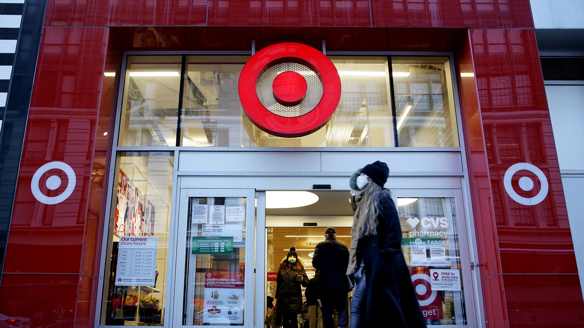 Photo of people walking in front of the exterior of a Target store