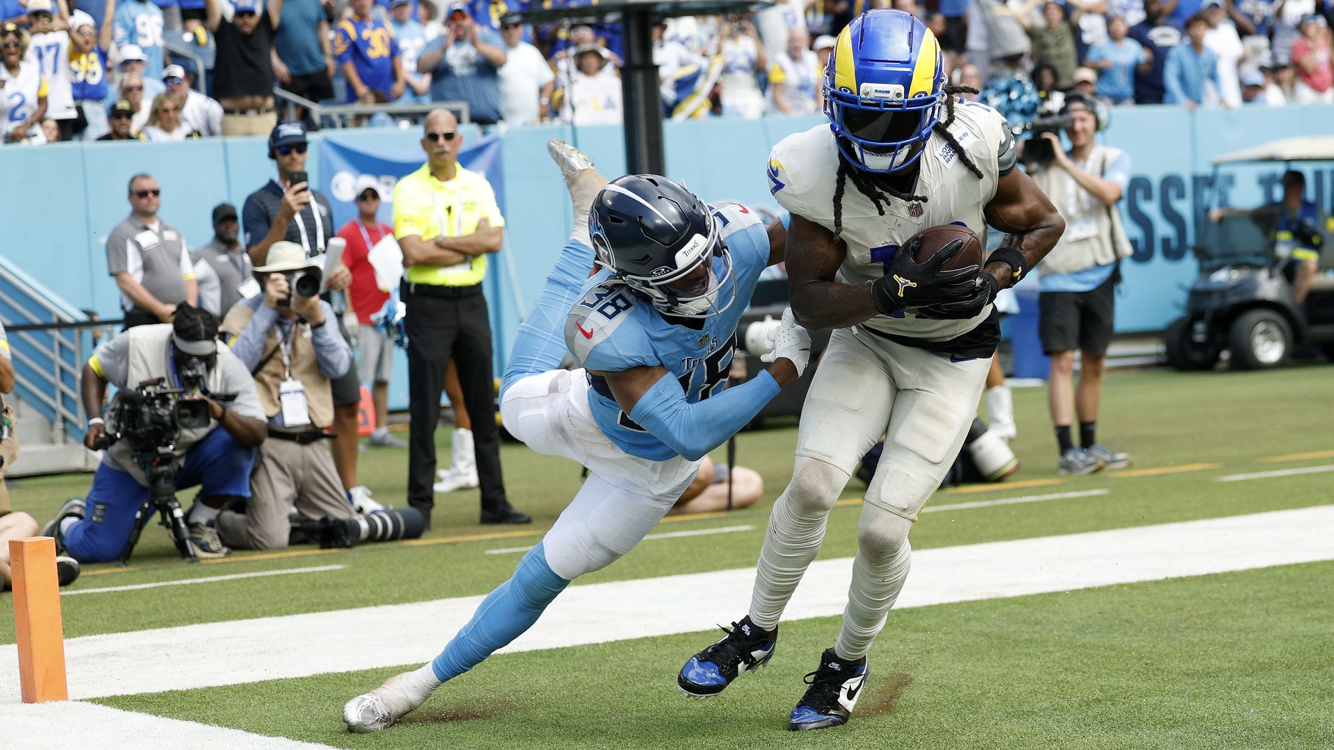 Davante Adams #17 of the Los Angeles Rams scores a touchdown reception against L'Jarius Sneed #38 of the Tennessee Titans.