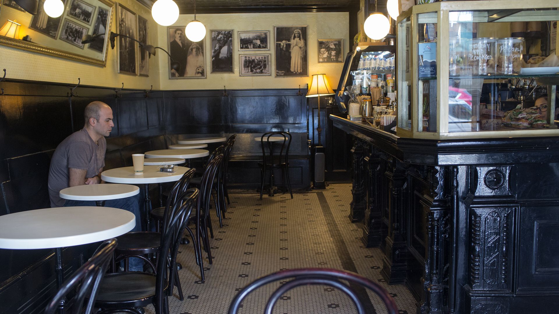 man alone in a cafe