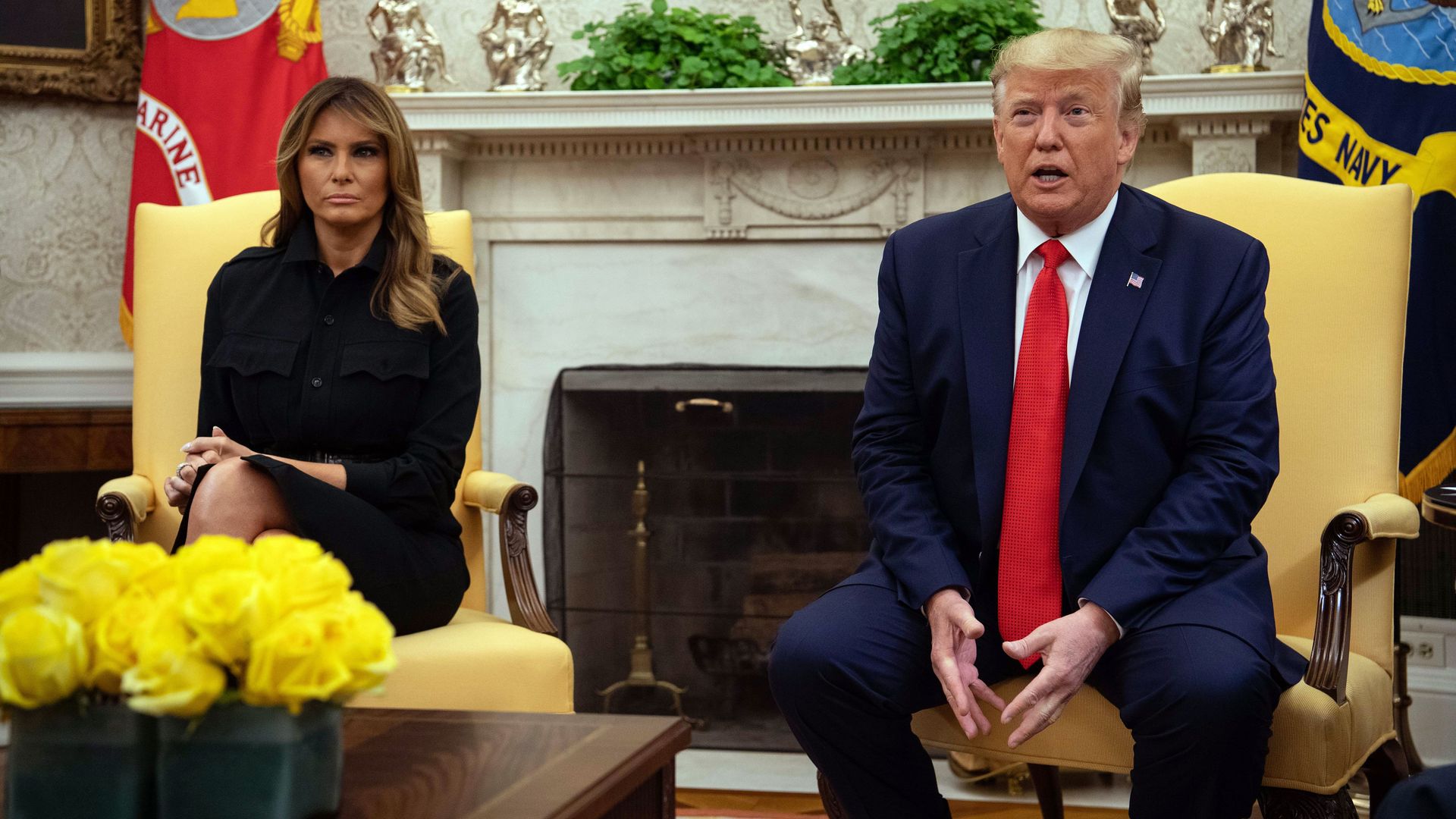 President Donald Trump, with First Lady Melania Trump, speaks to the press in the Oval Office at the White House in Washington, DC, on September 11