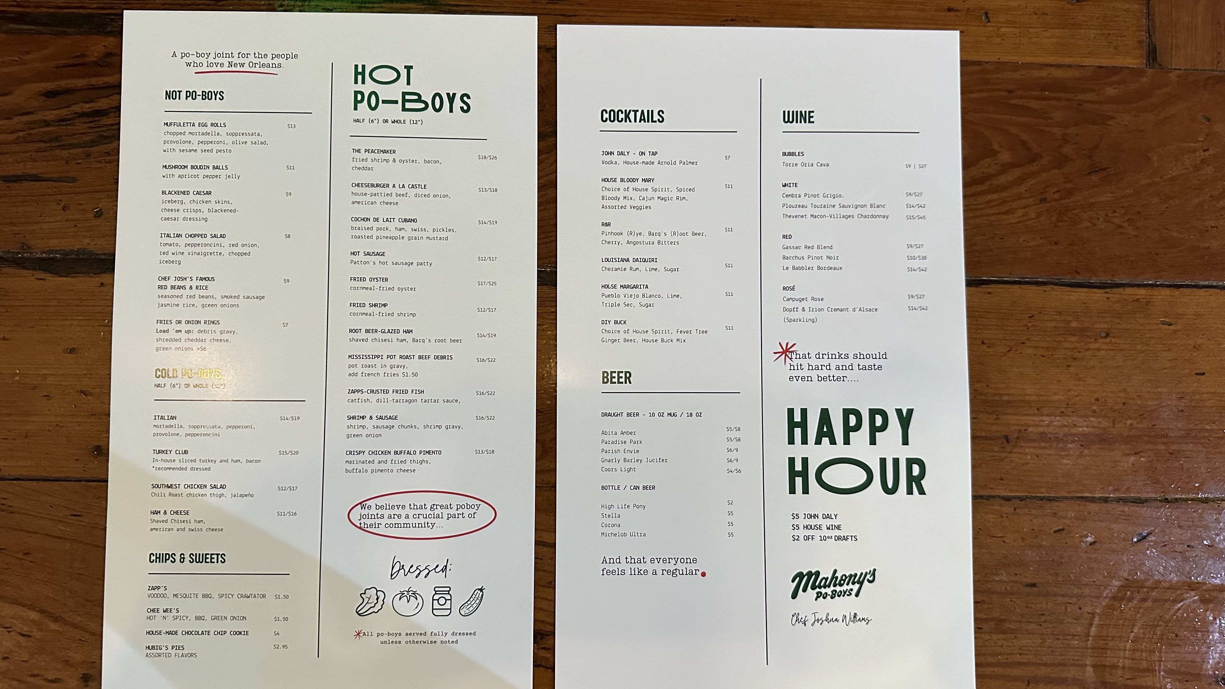 A photo of two menus, side by side, on a bar.