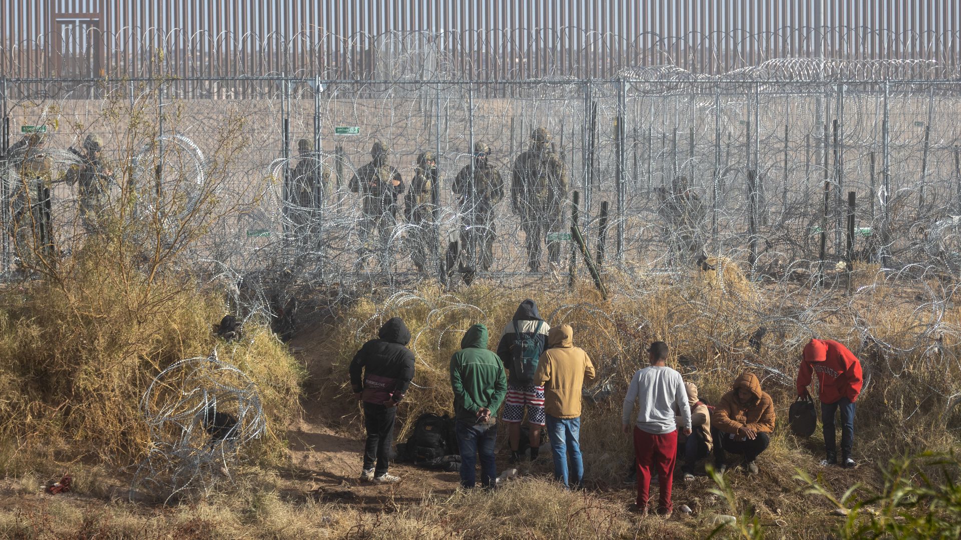 Migrants near the Rio Grande along the US-Mexico border in Juarez, Chihuahua state, Mexico, on Wednesday, Dec. 18, 2024. President-elect Donald Trump's transition team has reached out to the governments of Mexico and El Salvador through back channels about taking in some of the millions of undocumen