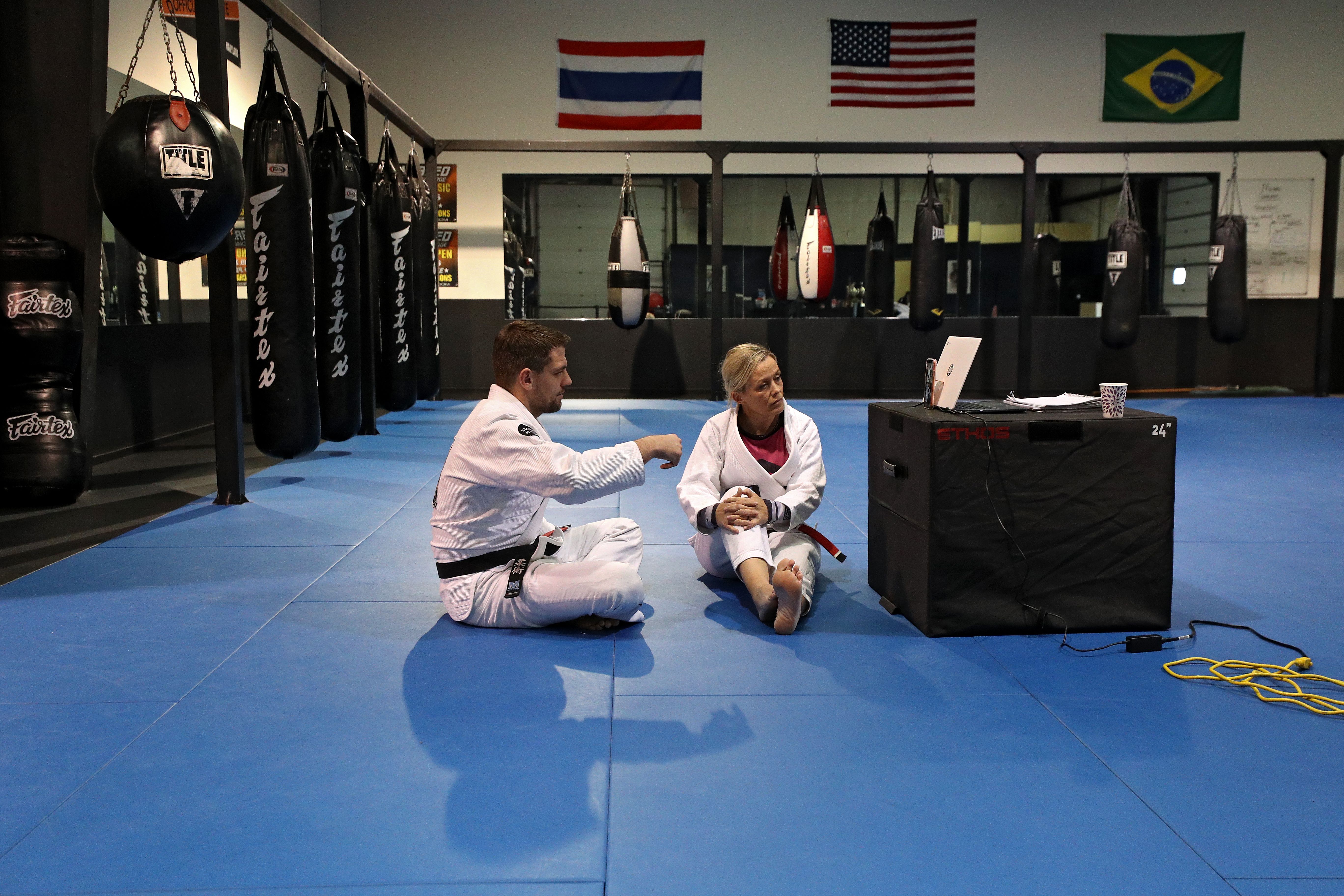 MMA teachers sitting on the ground