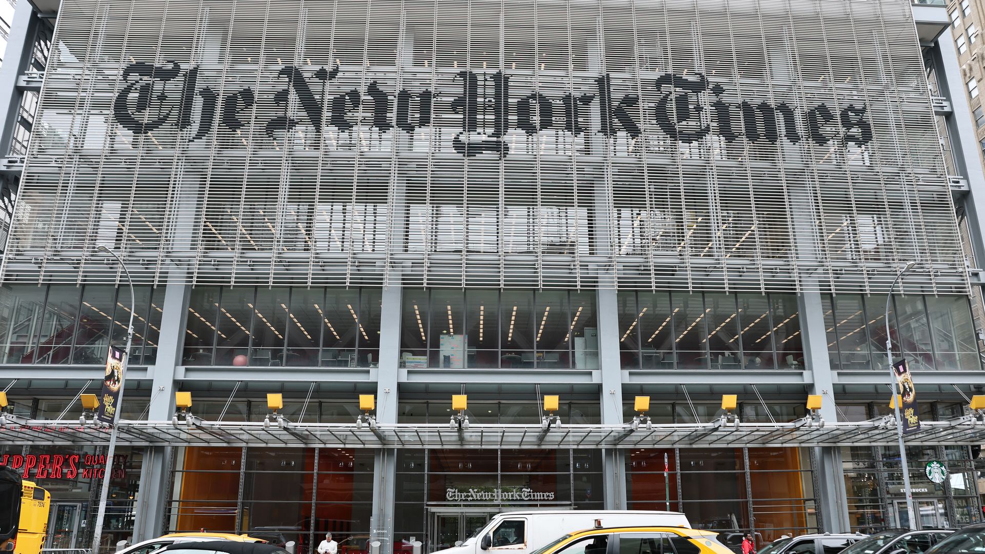New York Times building with cars visible in front 