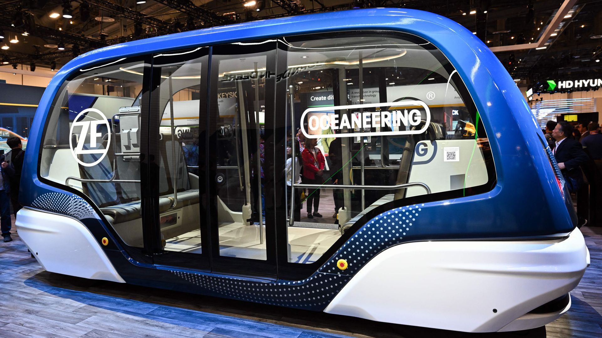 A ZF in partnership with Oceaneering autonomous shuttle transit vehicle is displayed at the HD Hyundai booth during the Consumer Electronics Show (CES) in Las Vegas, Nevada on January 5, 2023. (Photo by Patrick T. Fallon / AFP) (Photo by PATRICK T. FALLON/AFP via Getty Images)