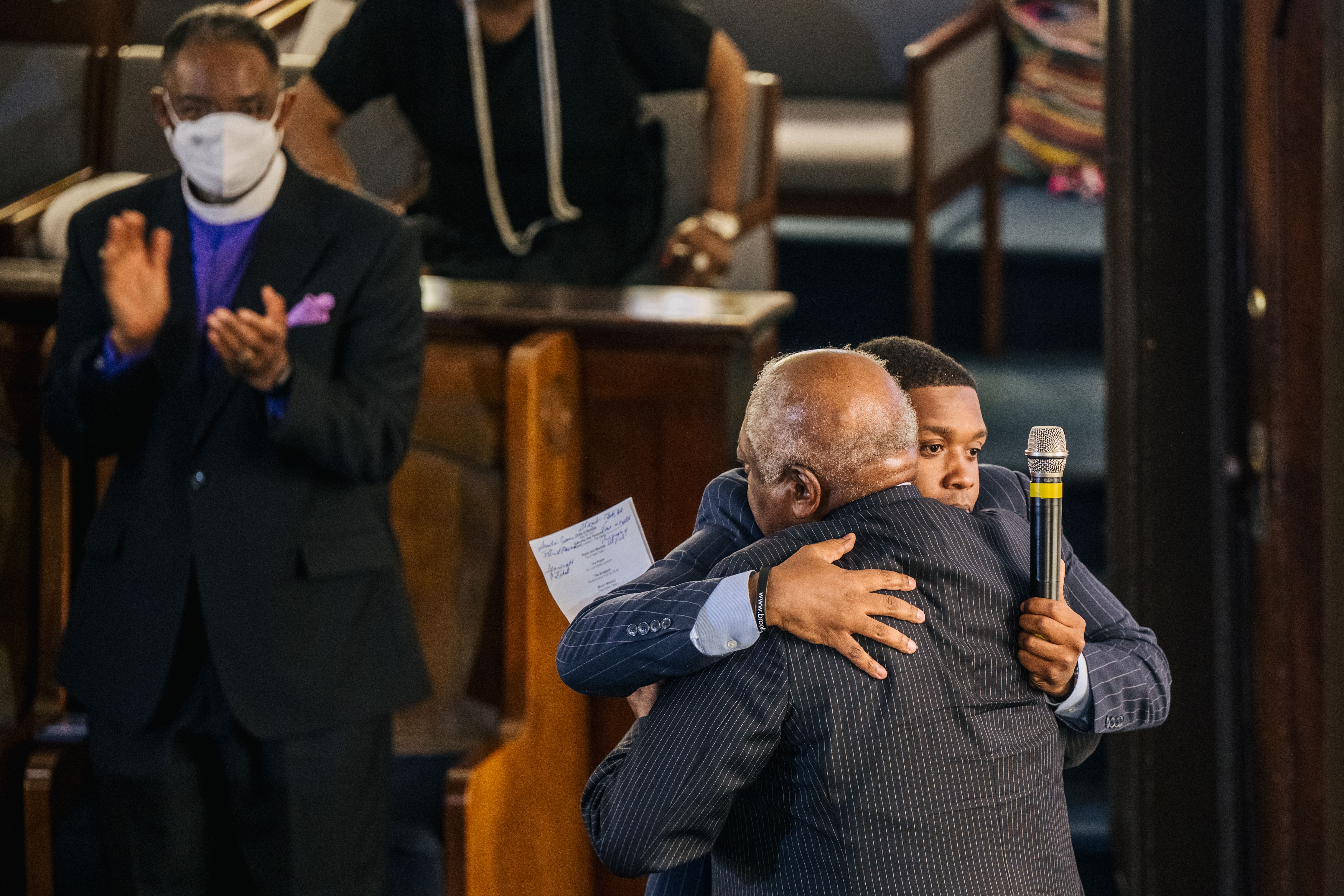 Rep. Jim Clyburn (D-SC) (R) is embraced before speaking at the AME Church in the Greenwood district on May 30, 2021 in Tulsa, Oklahoma. 