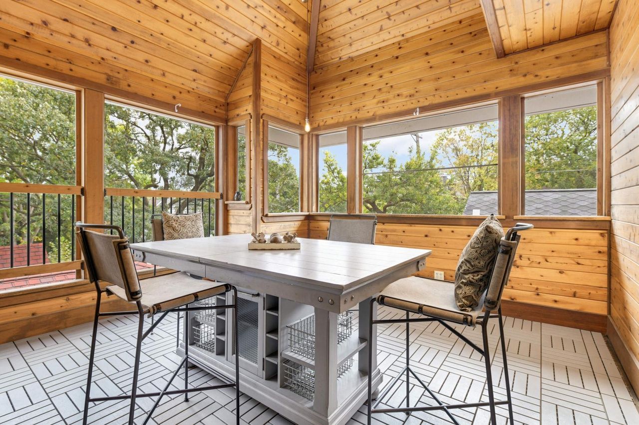 sunroom upstairs with wood panels