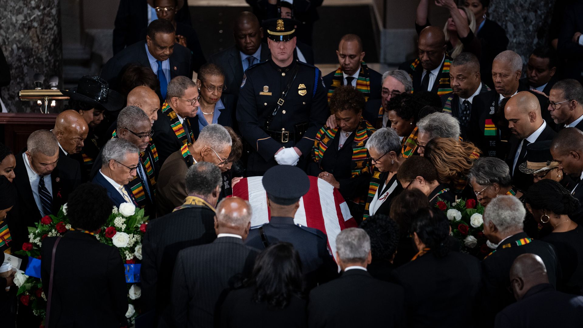Members of the Congressional Black Caucus pray over the casket of Rep. Elijah Cummings (D-Md.)