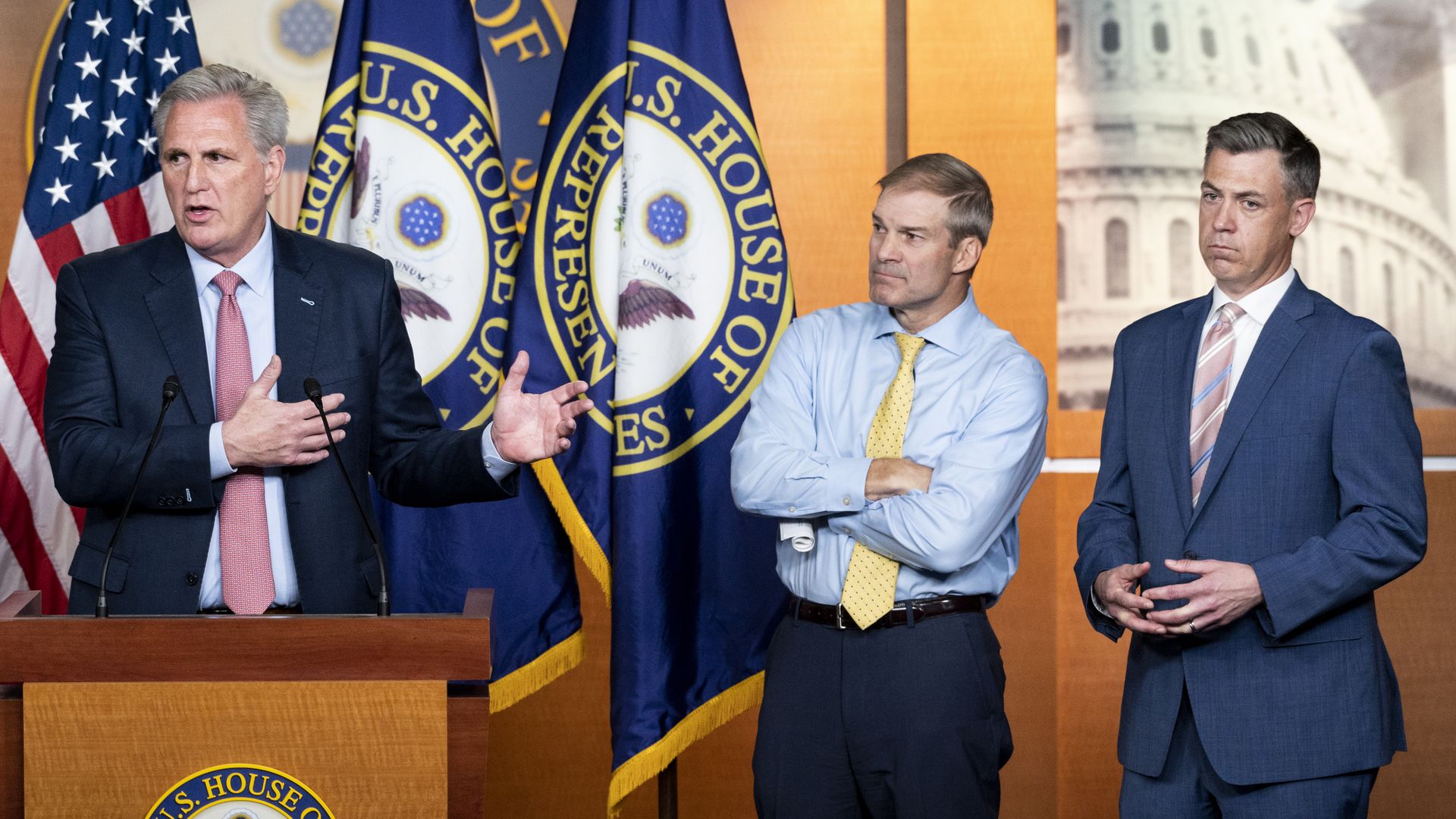 Reps. Jim Jordan and Jim Banks are seen listening as House Minority Leader Kevin McCarthy speaks at a news conference.