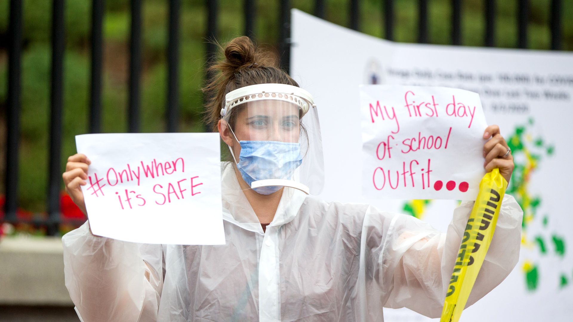 Woman protesting in front of Massachusetts State House