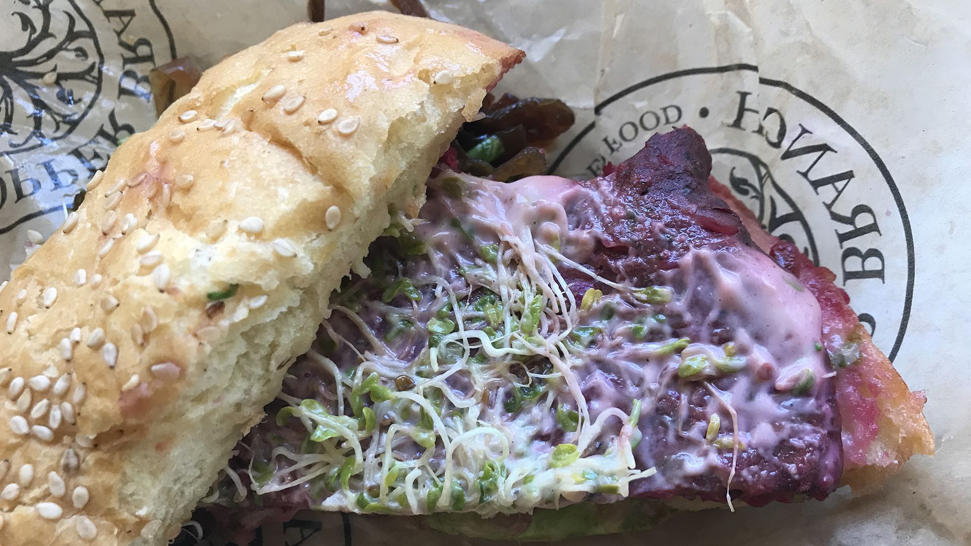A beet patty with organic brown rice, pea protein, sesame seeds, organic hemp and sunflower seeds, topped with Dijon vegenaise and alfalfa sprouts. 