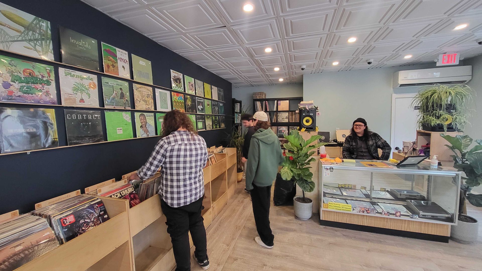 Customers search the crates at Music Research Library. 