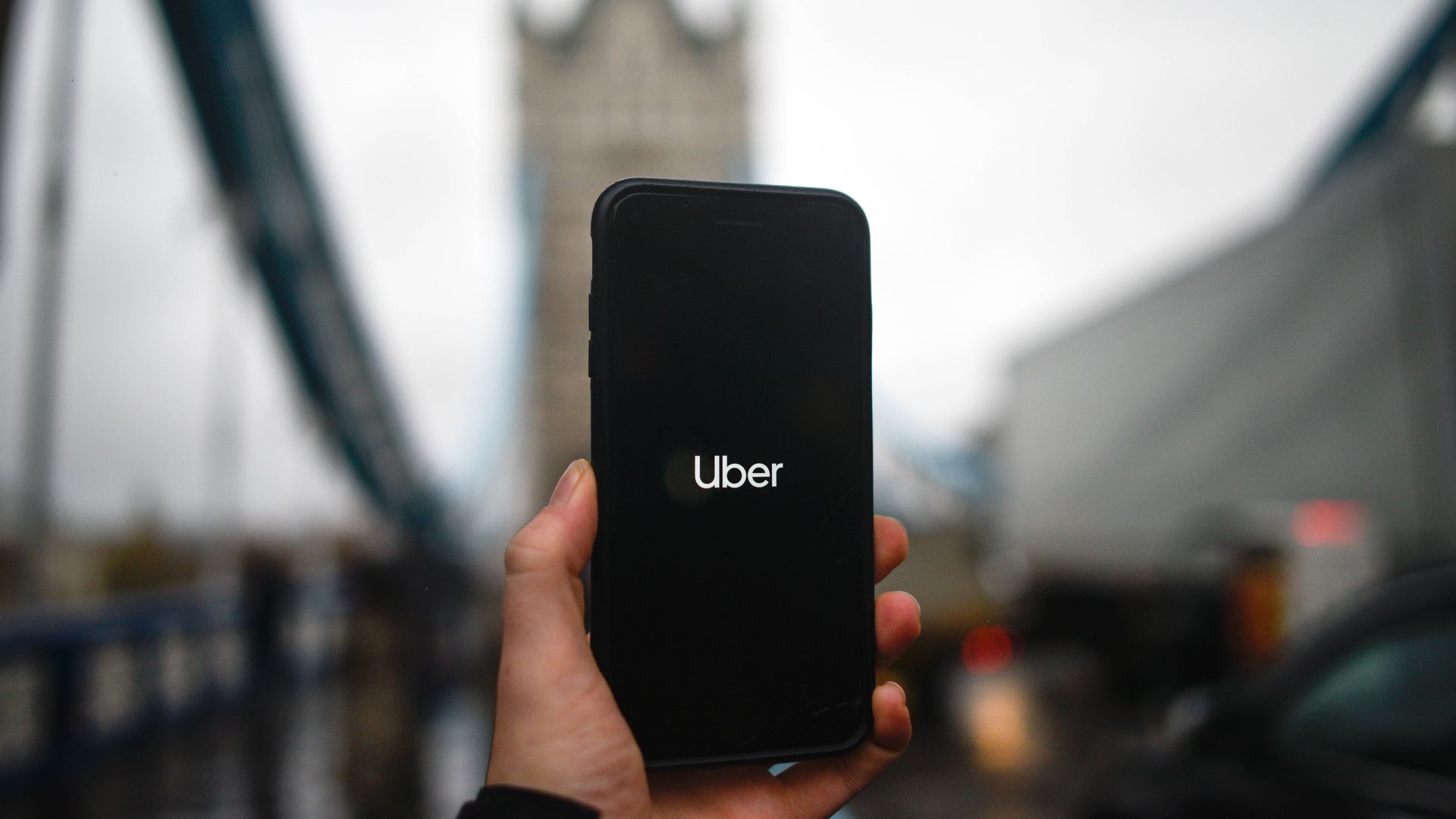 Uber logo on a phone in London