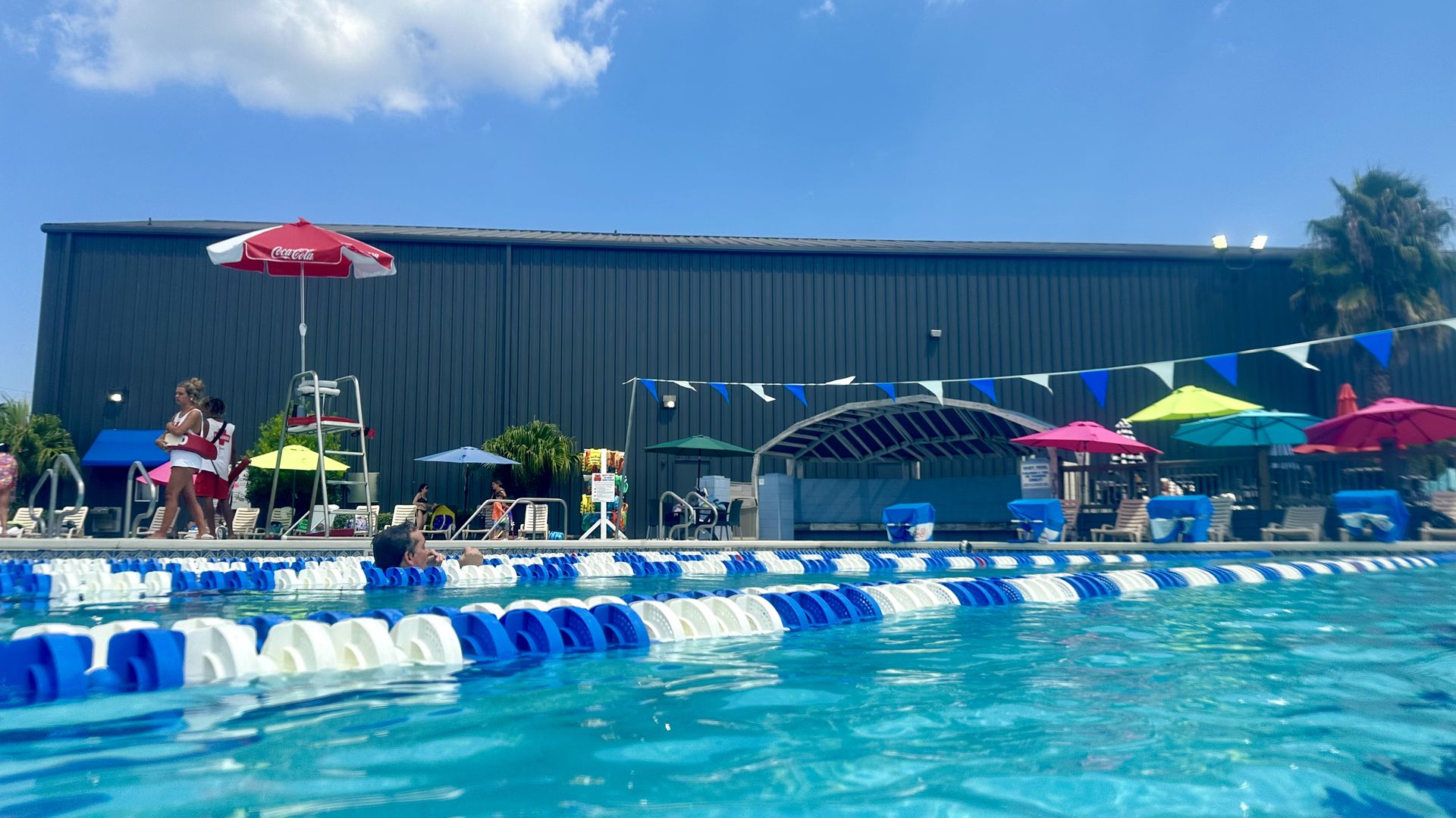 Photo shows the pool at Ochsner with umbrellas and swimming lanes.