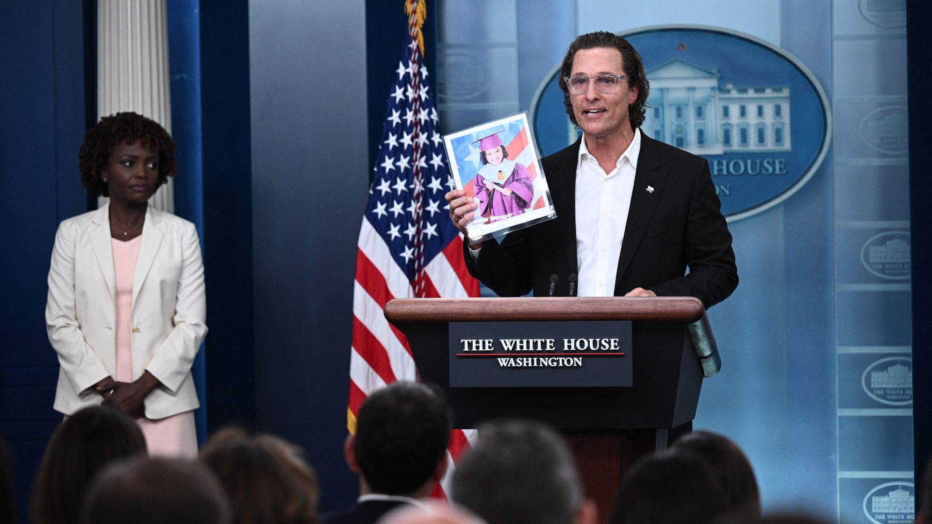 Matthew McConaughey holds a photo of Alithia Ramirez, a 10 year old student who was killed in the mass shooting at Robb Elementary School.