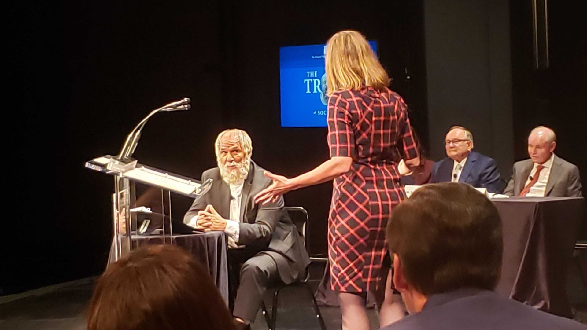 people at a courtroom on stage 