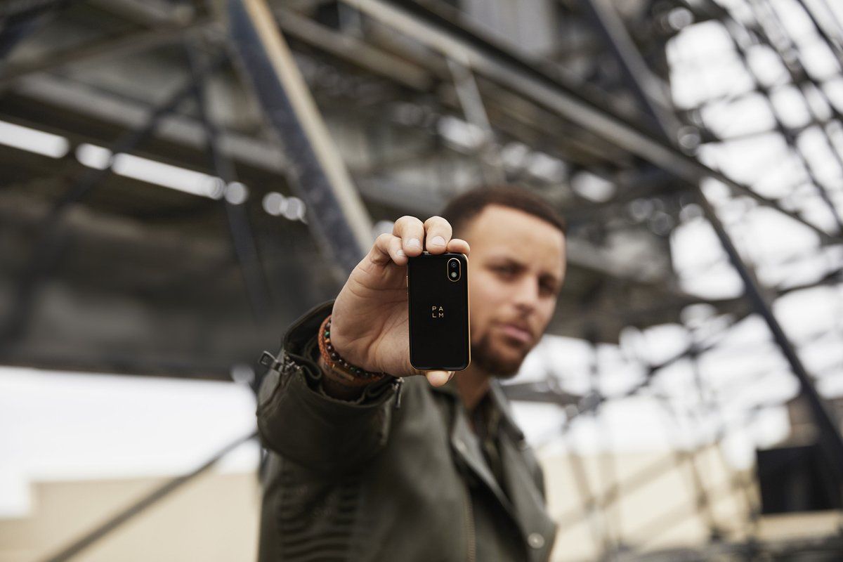 Stef Curry holding the new Palm phone
