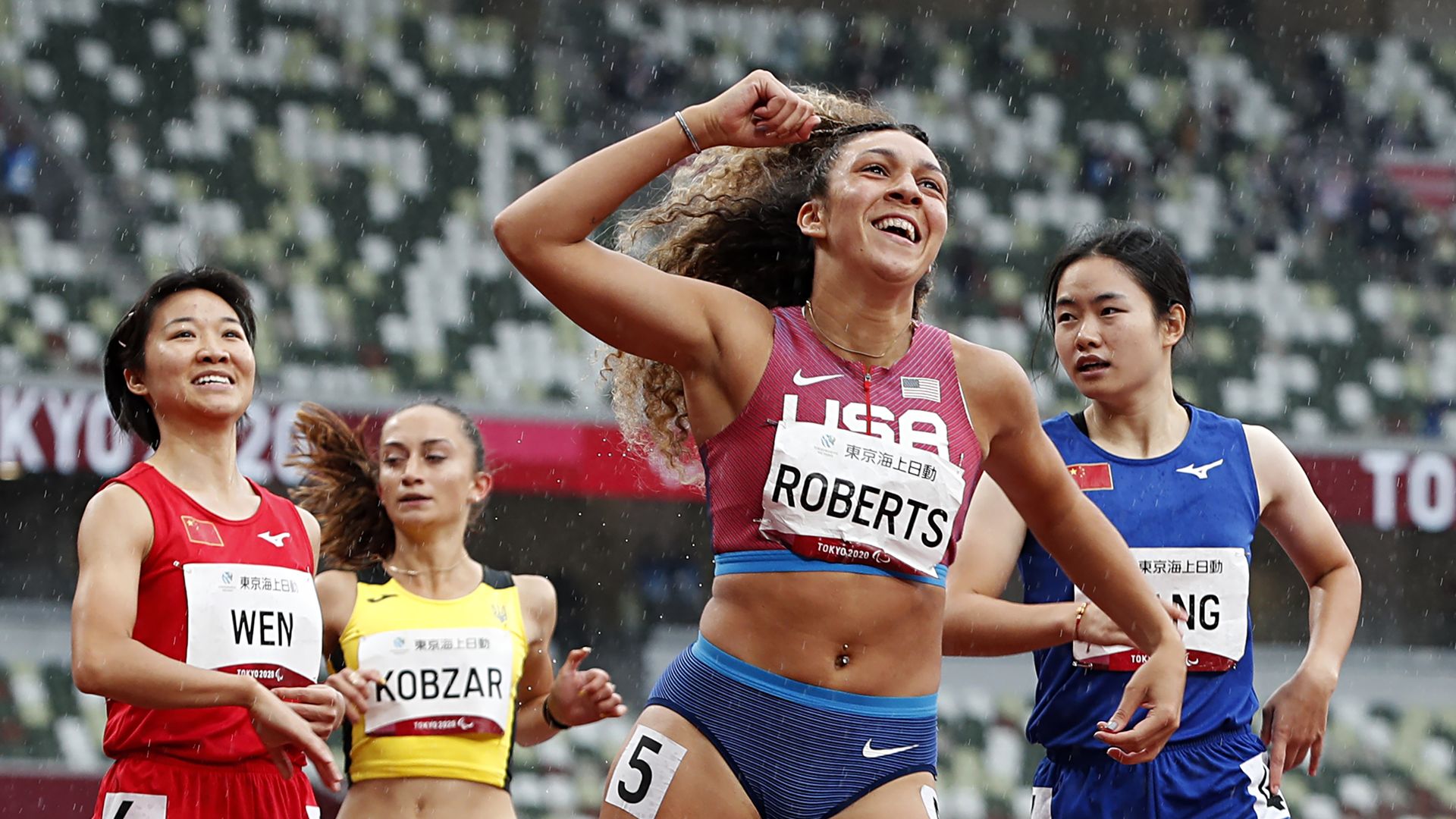 Paraolympians celebrating at a track and field event in the 2020 Tokyo games.  