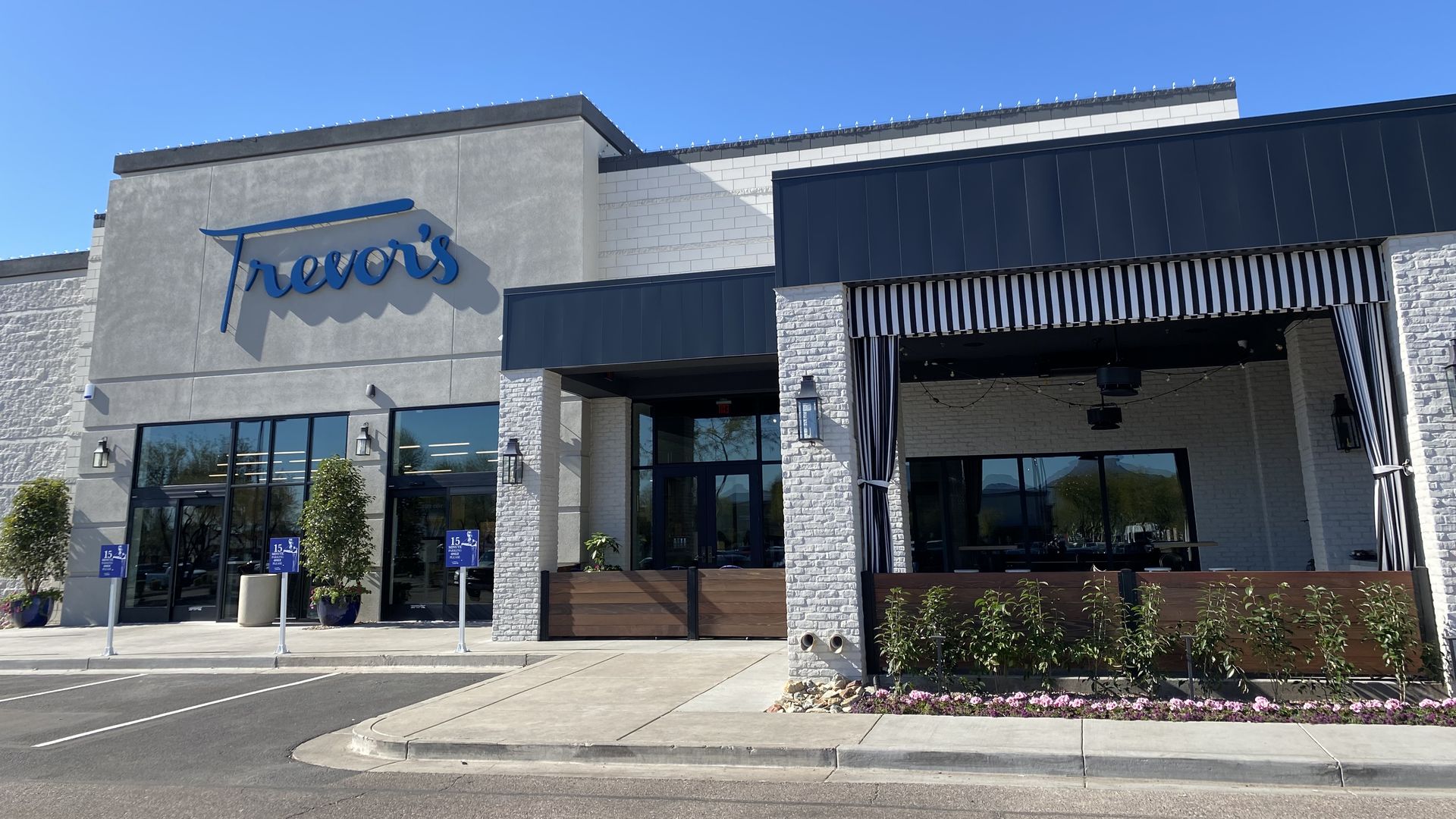 A storefront with a sign that reads Trevor's.