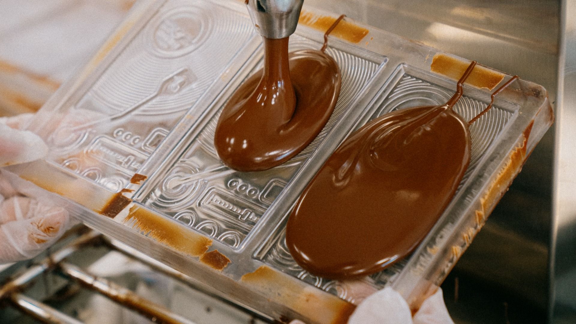 Chocolate is poured into molds for bars at Cocoa Legato.