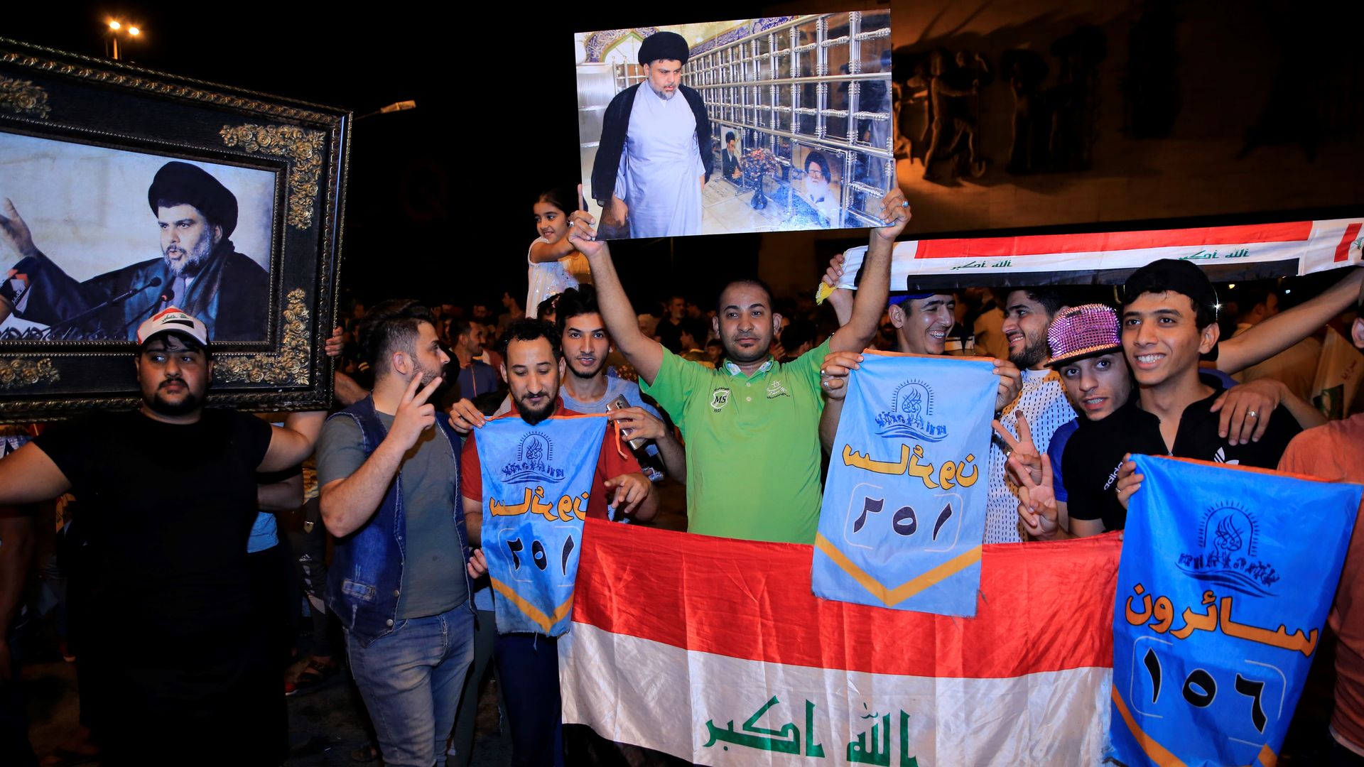 Supporters of Iraqi Shiite cleric Moqtada al-Sadr celebrate the results of the parliamentary election at the Tahrir Square, Baghdad, Iraq, on May 13, 2018.