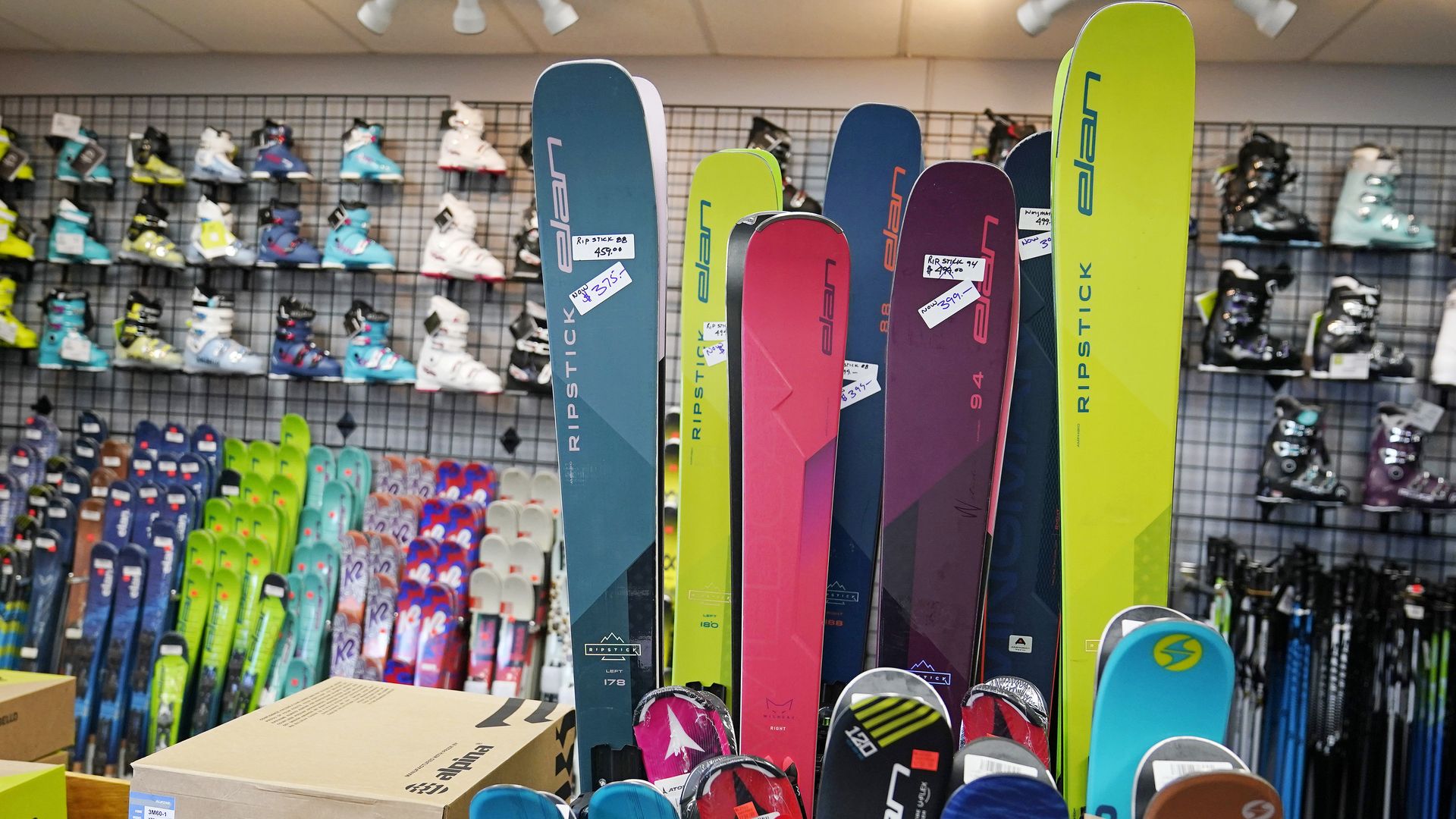 Skis and boots are displayed at a ski shop. Photo: Charles Krupa/AP