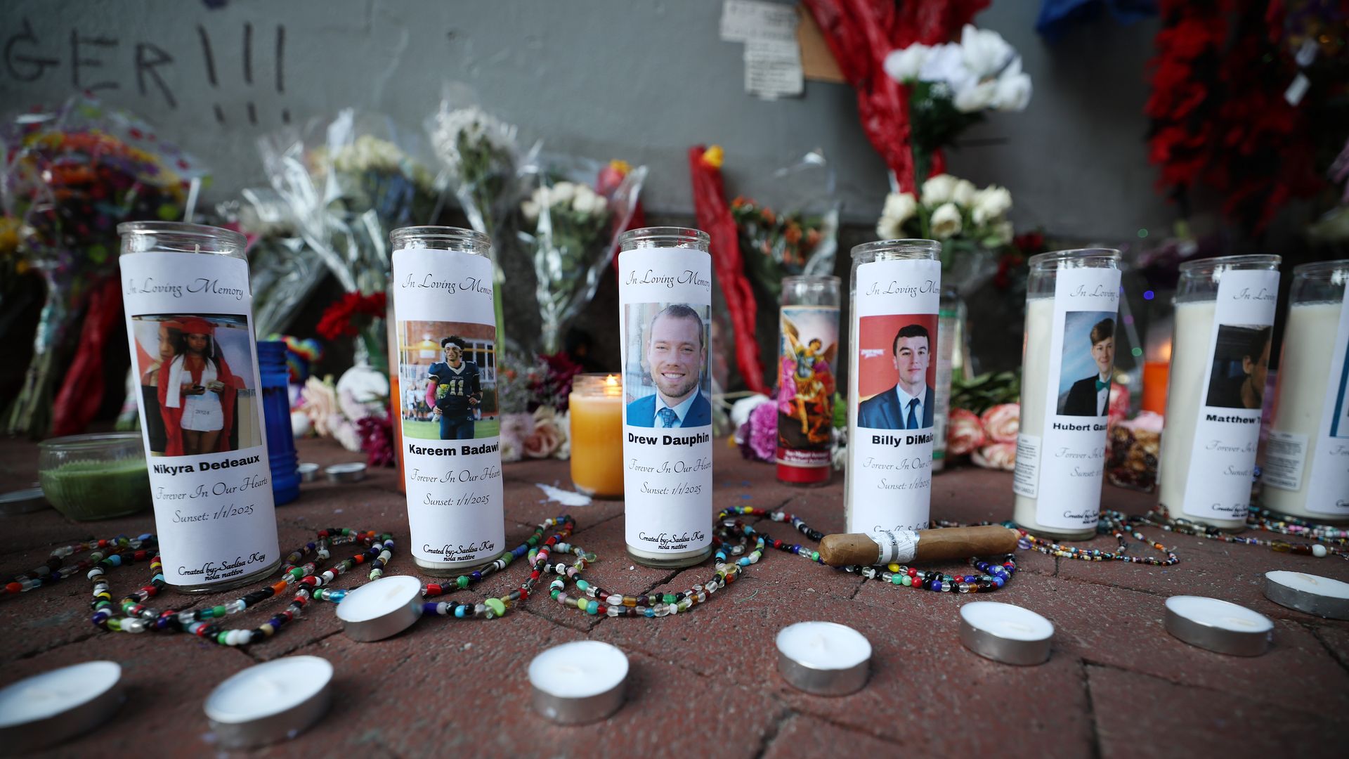 Photo shows candles for a memorial.