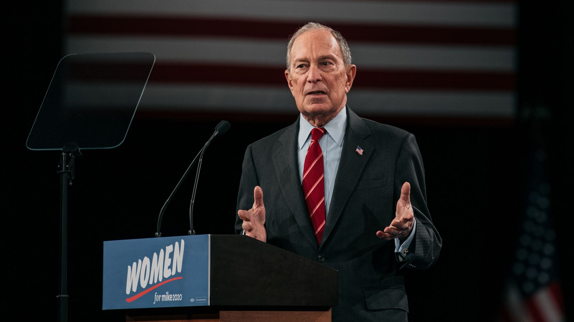 Michael Bloomberg at a podium.