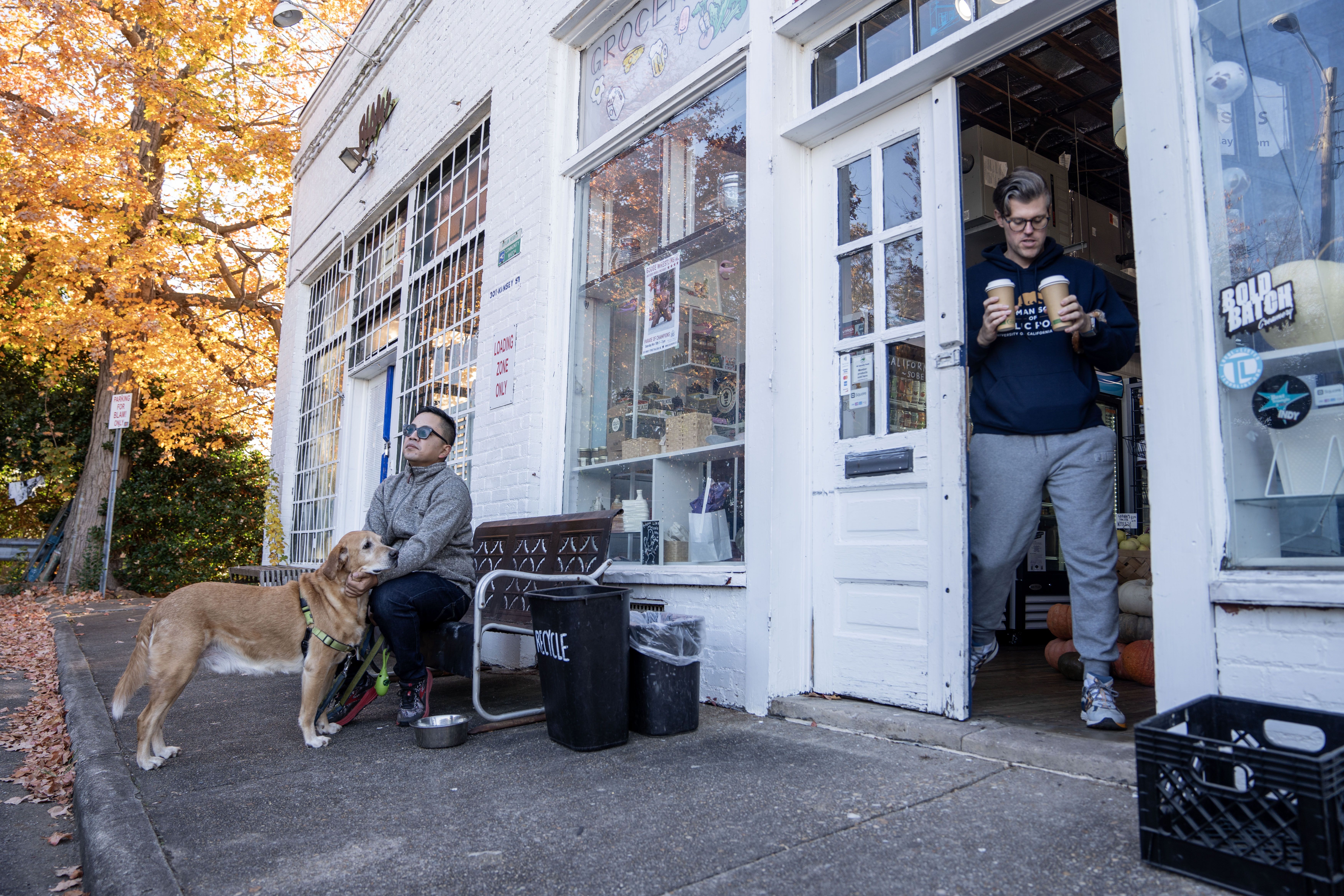 Kody Kinsley, his partner Angelo Mathay and their dog, Kopuk, on their morning coffee run. 