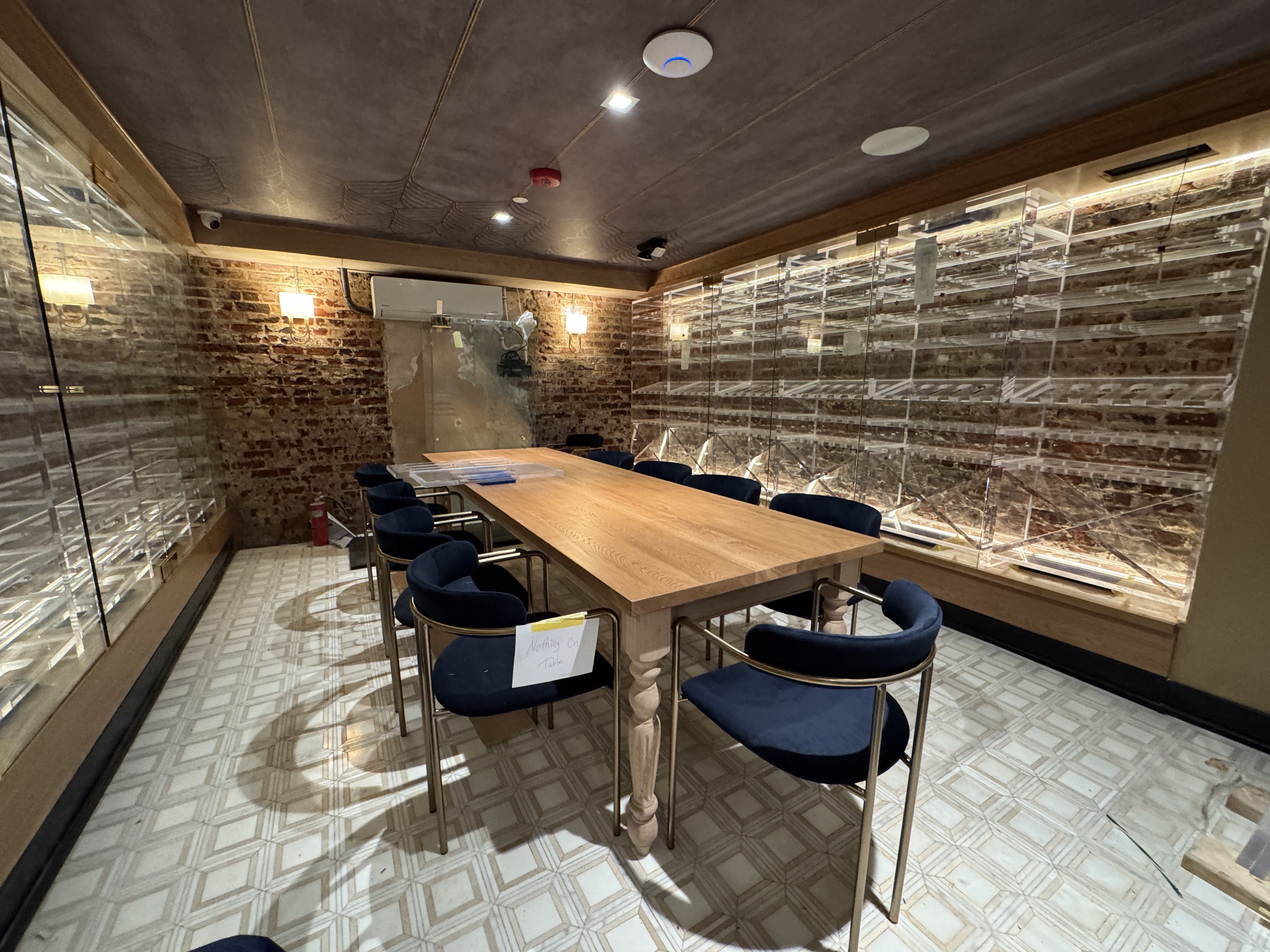 inside a wine cellar with a table in the center