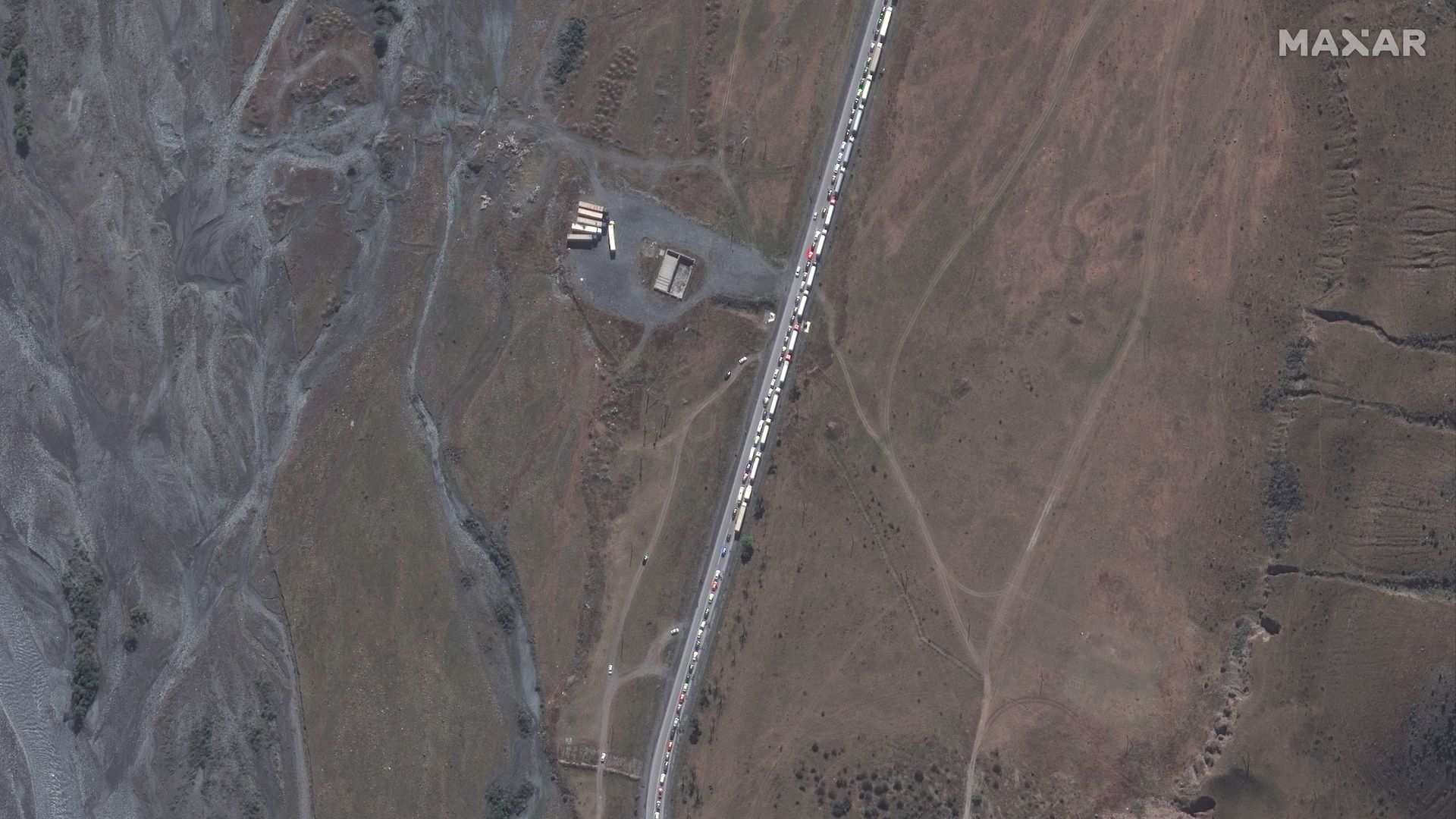 A satellite image showing the large traffic jam of trucks and cars waiting to cross the border into Georgia.