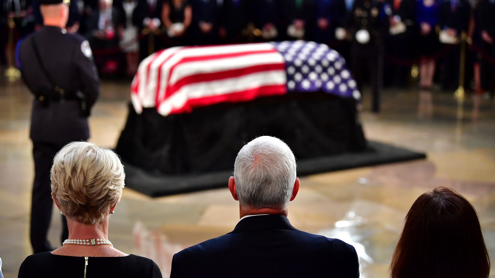 VP Mike Pence and and wife Karen Pence view the casket of former Senator John McCain draped in an American flag in the Capitol Rotunda