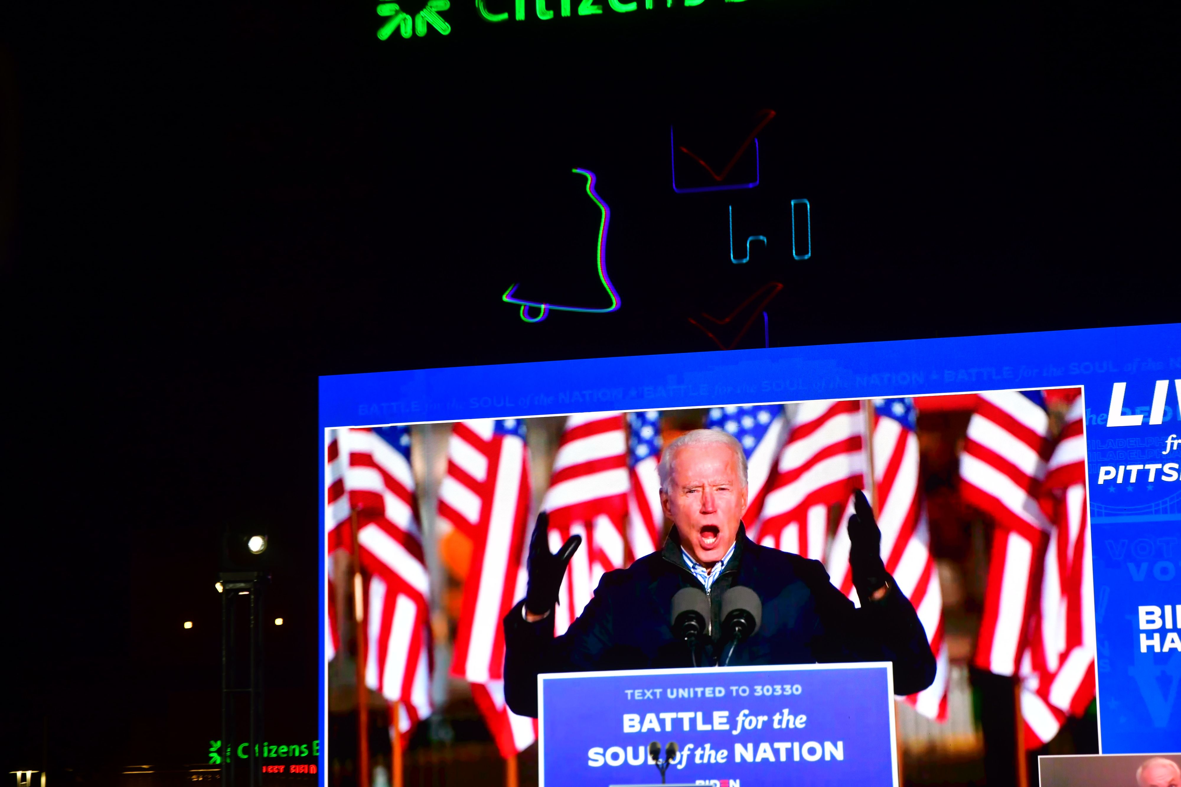 Joe Biden on a TV screen during a a drive-in election eve rally with Democratic vice presidential nominee Sen. Kamala Harris (D-CA) on November 2, 2020 in Philadelphia, Pennsylvania.