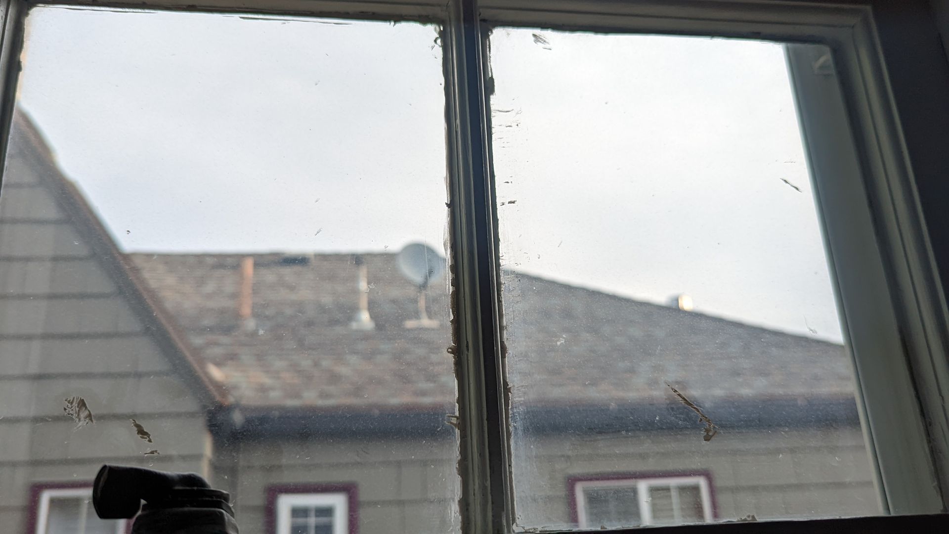Paint splotches on window panes.