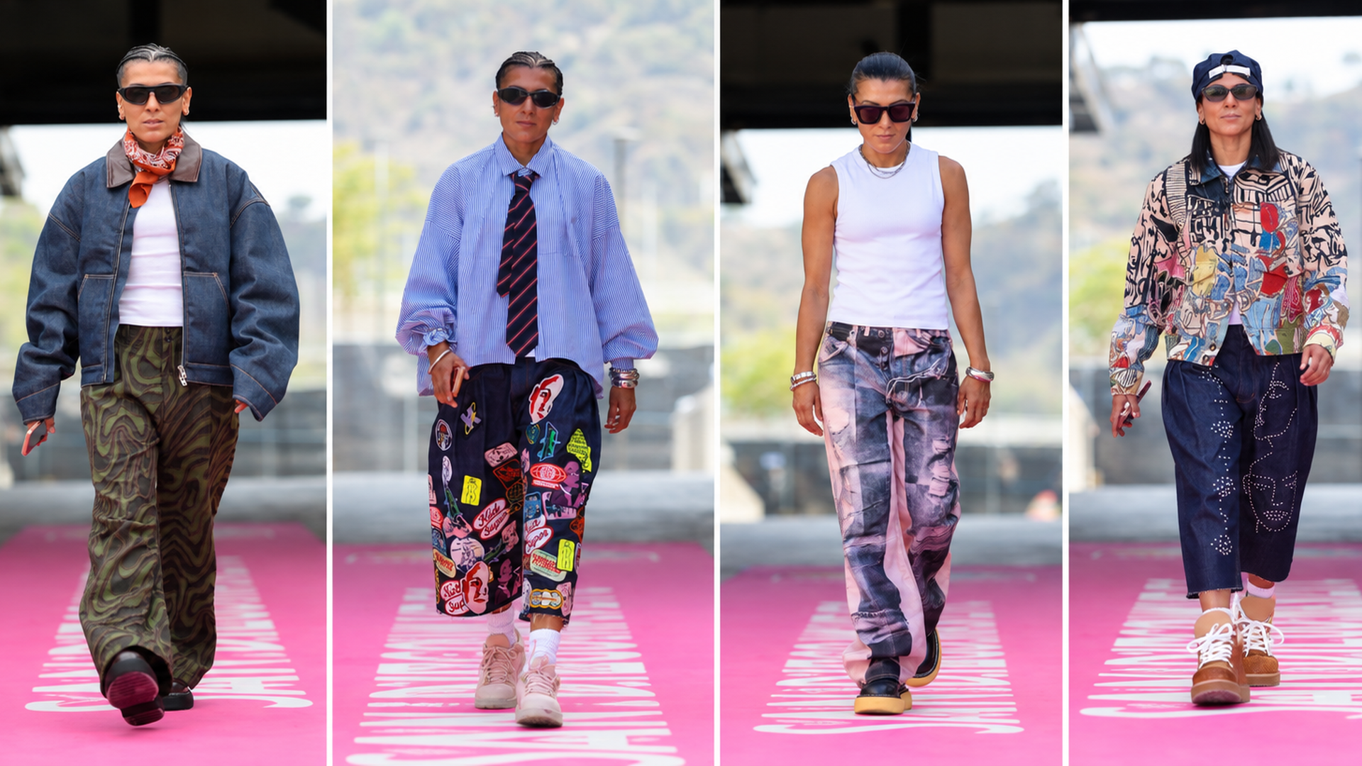 Five models stride a pink runway with white lettering, showcasing bold streetwear: oversized pieces, camo pants, patchwork jeans, and patterned jackets.