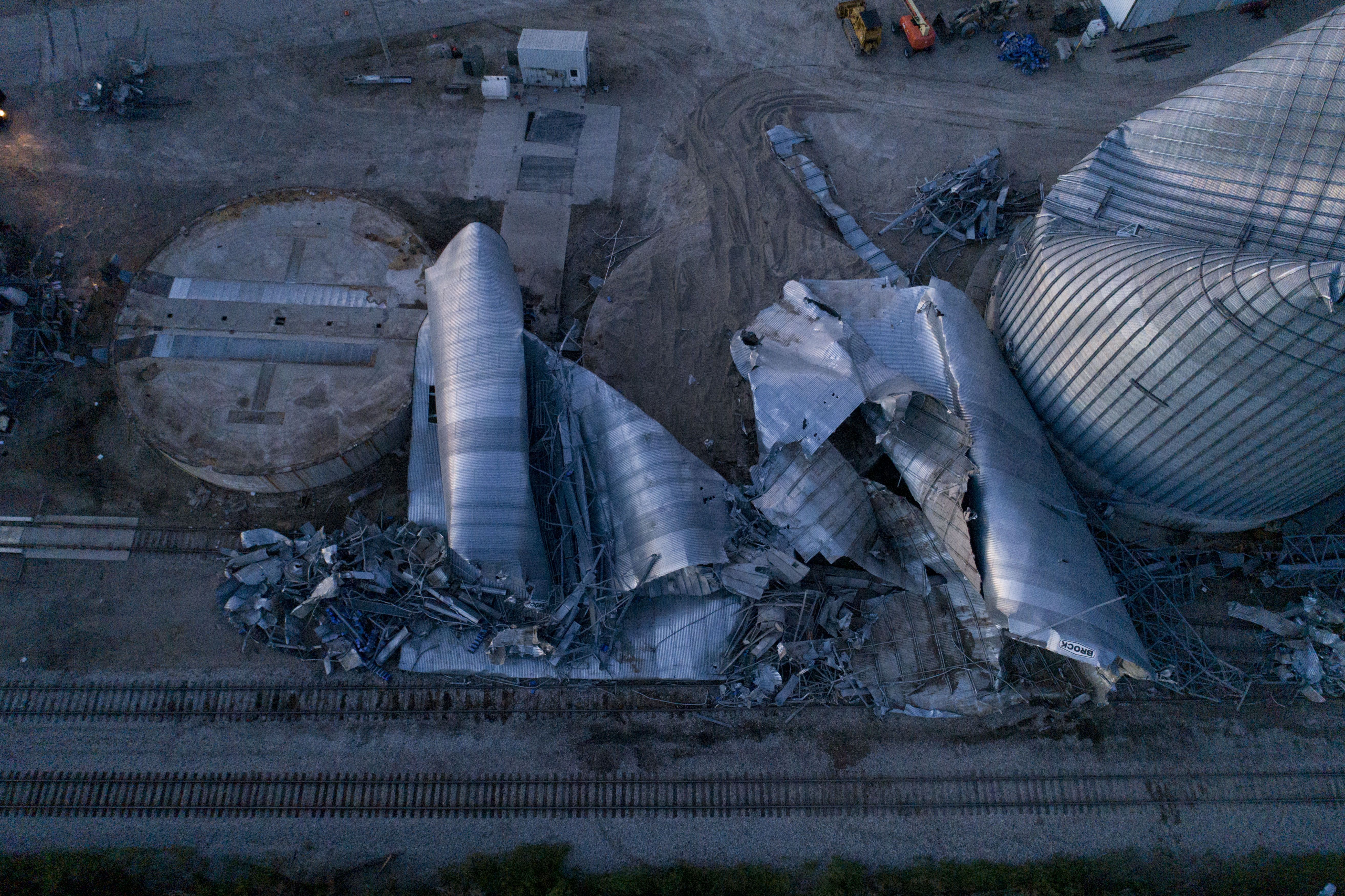 Crushed grain bins seen from overhead at night