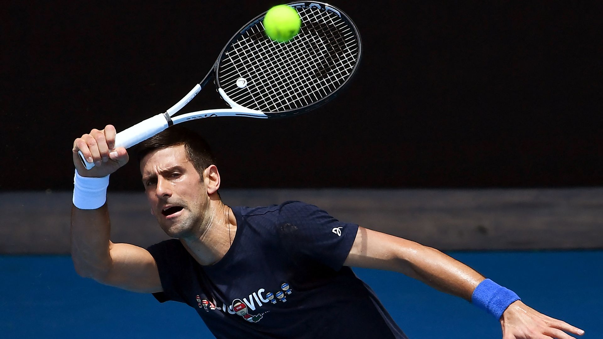  Novak Djokovic of Serbia hits a return during a practice session ahead of the Australian Open at the Melbourne Park tennis centre in Melbourne on January 12
