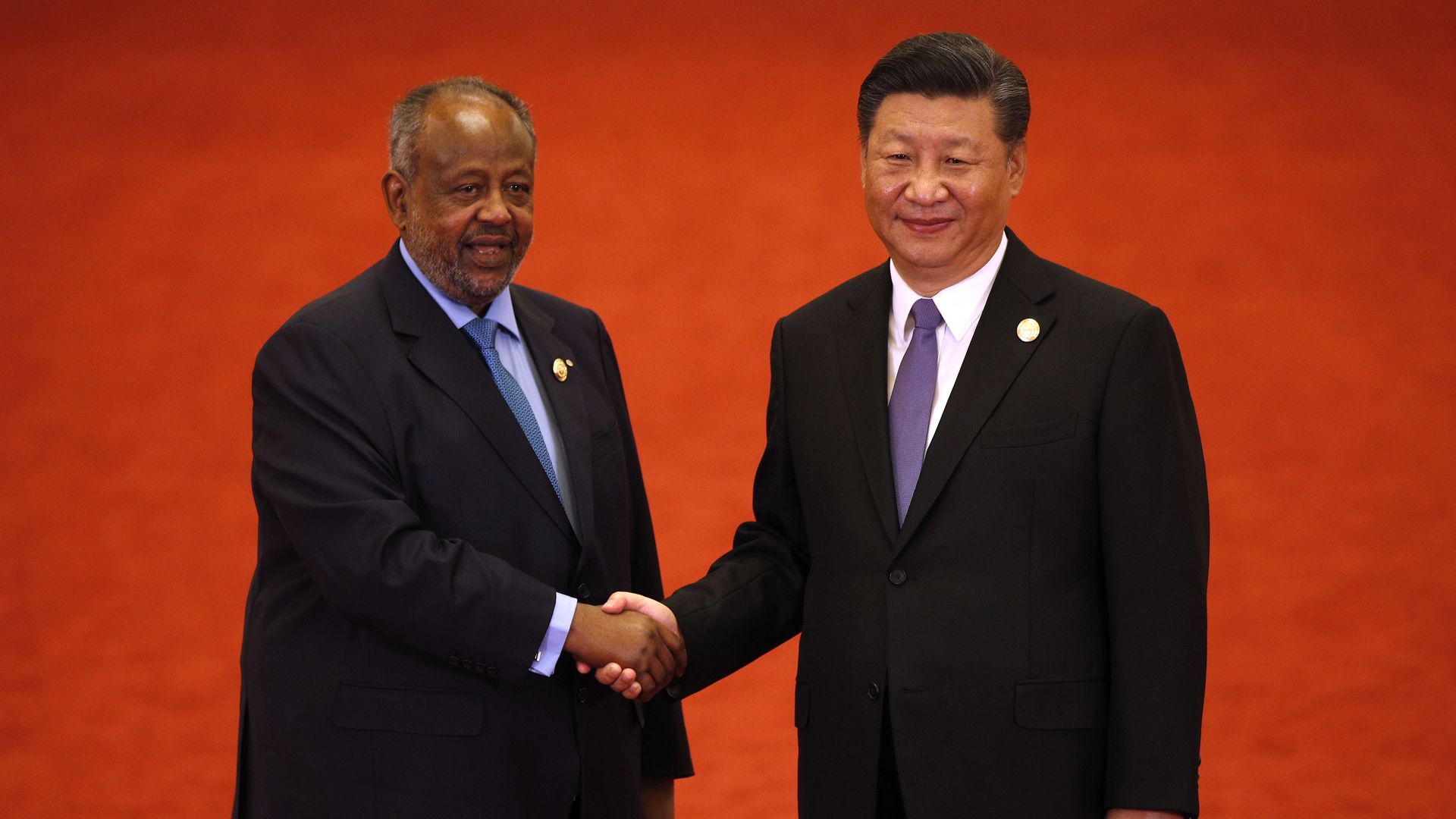 Djibouti's President Ismail Omar Guelleh shakes hands with Chinese President Xi Jinping during the Forum on China-Africa Cooperation on September 3, 2018 in Beijing, China.