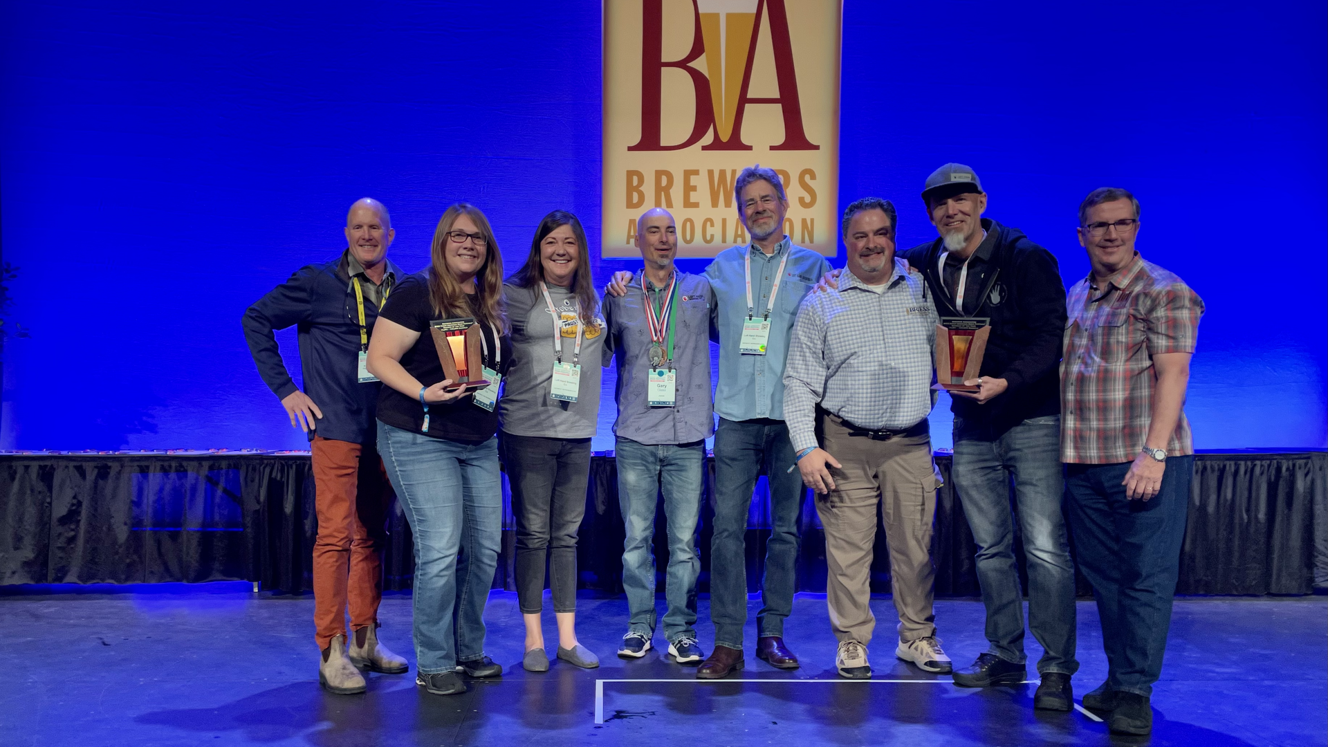 Left Hand Brewing's crew accepts a GABF medal on stage at the awards ceremony in Denver. Photo: John Frank/Axios