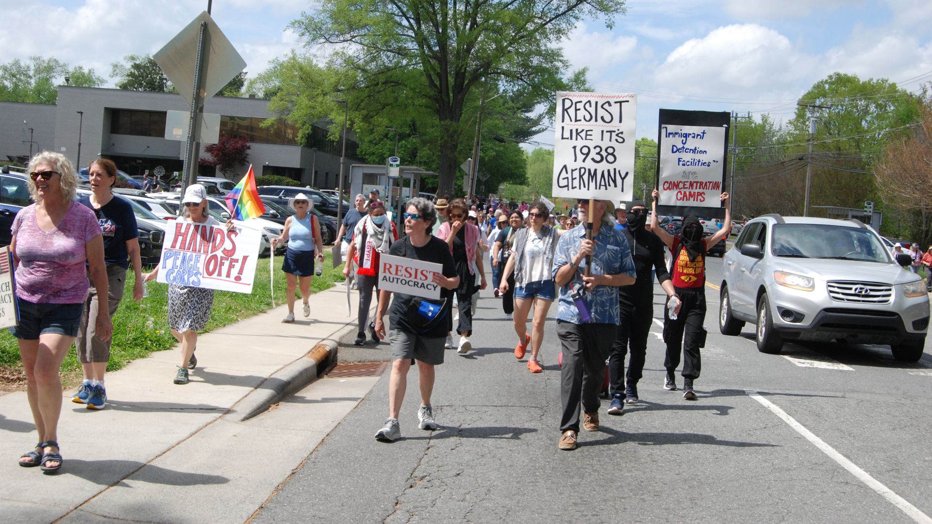 Protestors march down Randolph Road in Charlotte