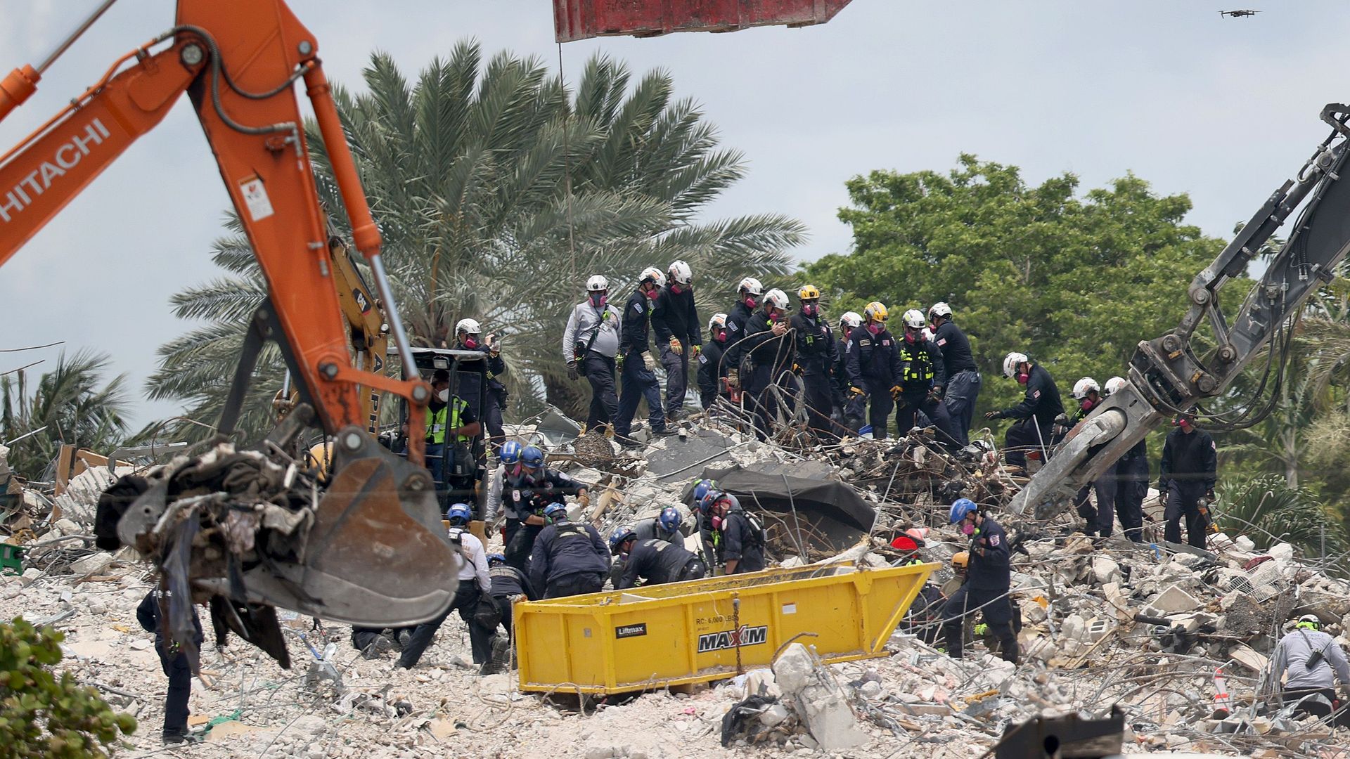 Machinery is used to delicately search the rubble at the site of the building collapse in Surfside, Florida.
