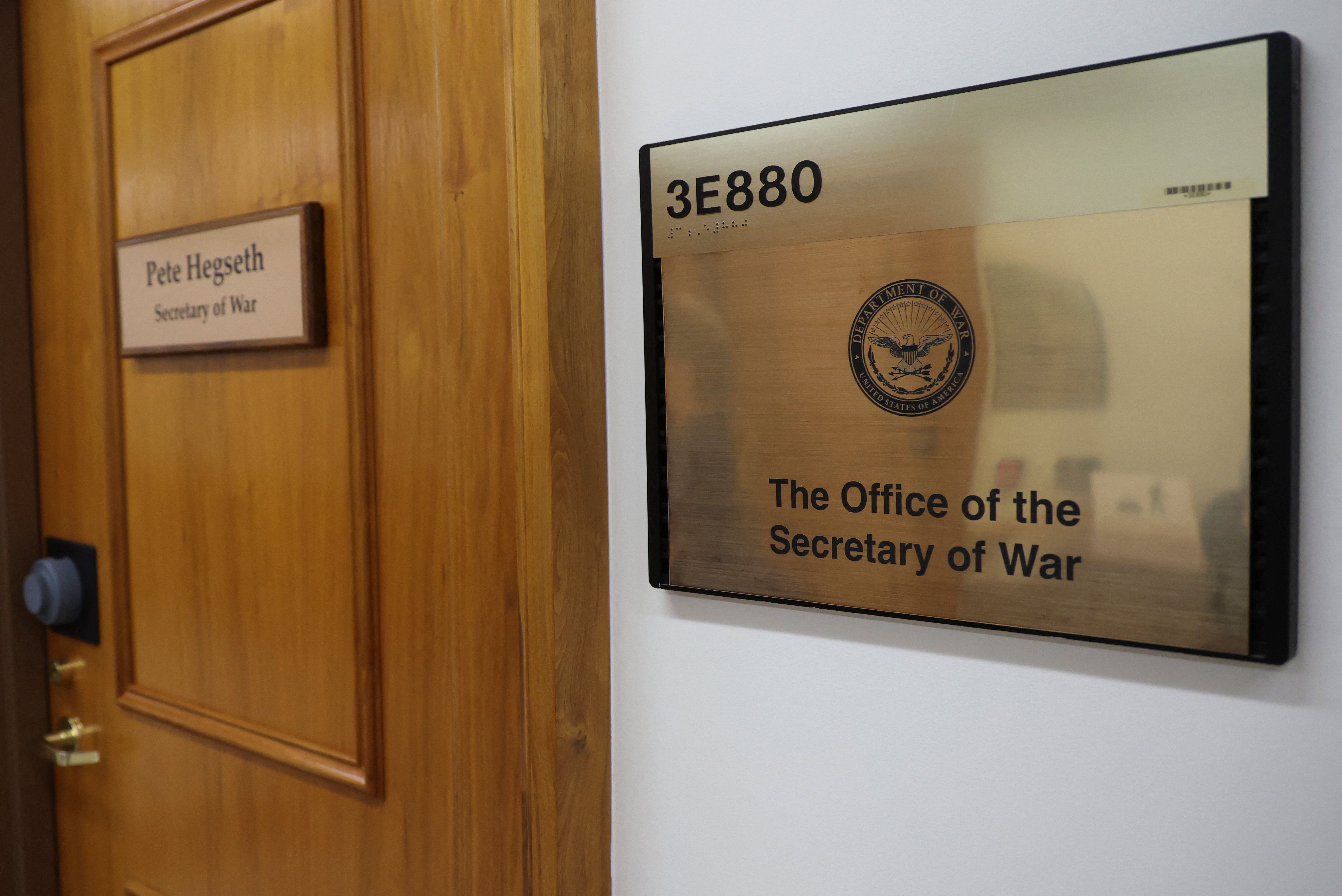 A sign that reads "Pete Hegseth - Secretary of War" is displayed on a door, after U.S. President Donald Trump ordered the Department of Defense to be renamed as the "Department of War," reverting to a title it held until after World War Two when officials sought to emphasize the Pentagon's role in p