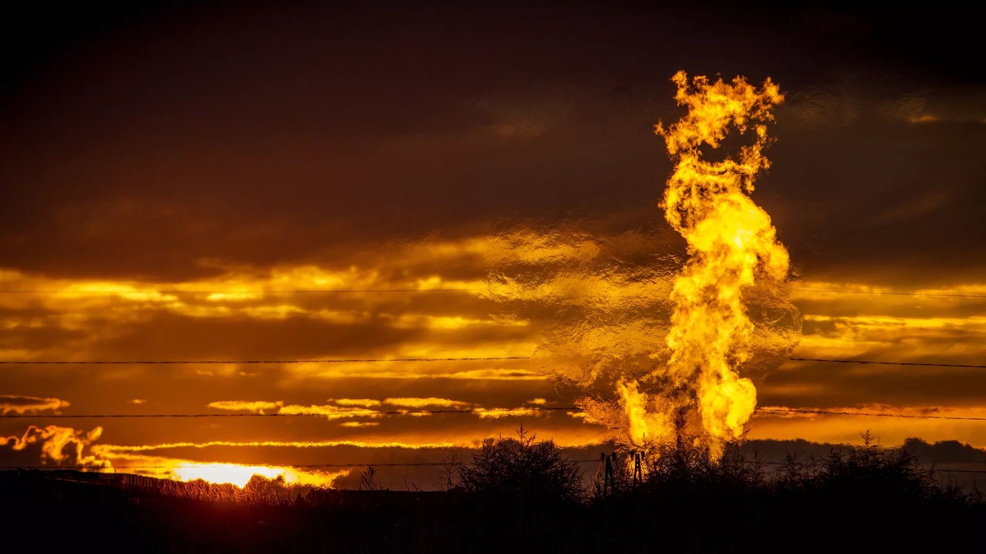 Flames from a flaring pit near a well in the Bakken Oil Field. 
