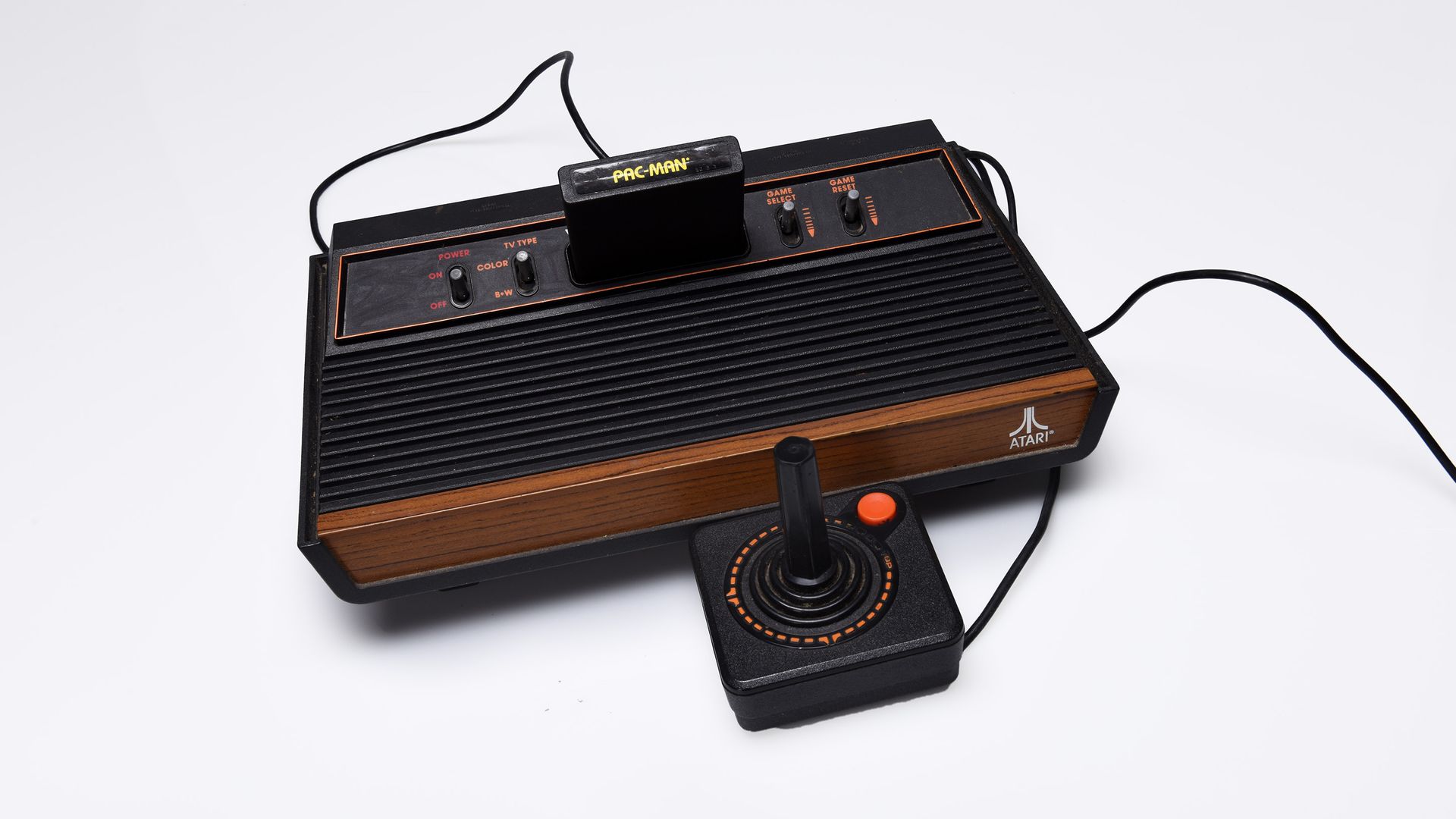 Photograph of a classic Atari game console and joystick