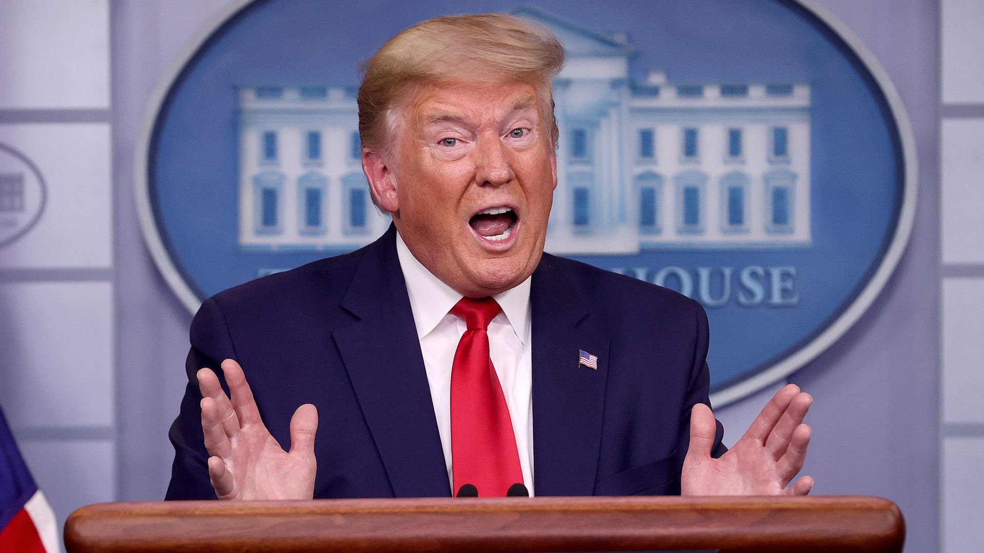 President Donald Trump answers questions in the press briefing room