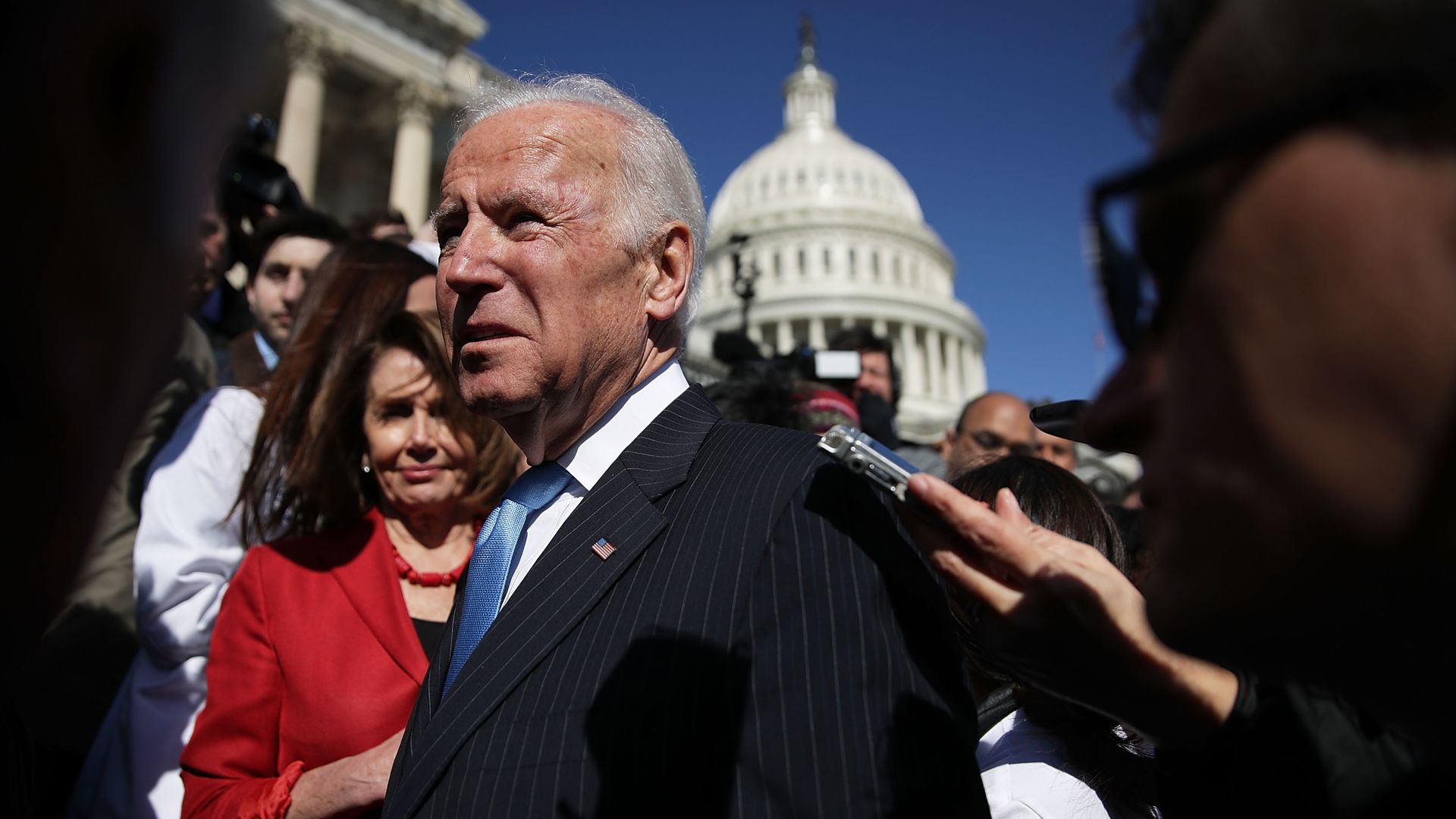 Joe Biden surrounded by a crowd.