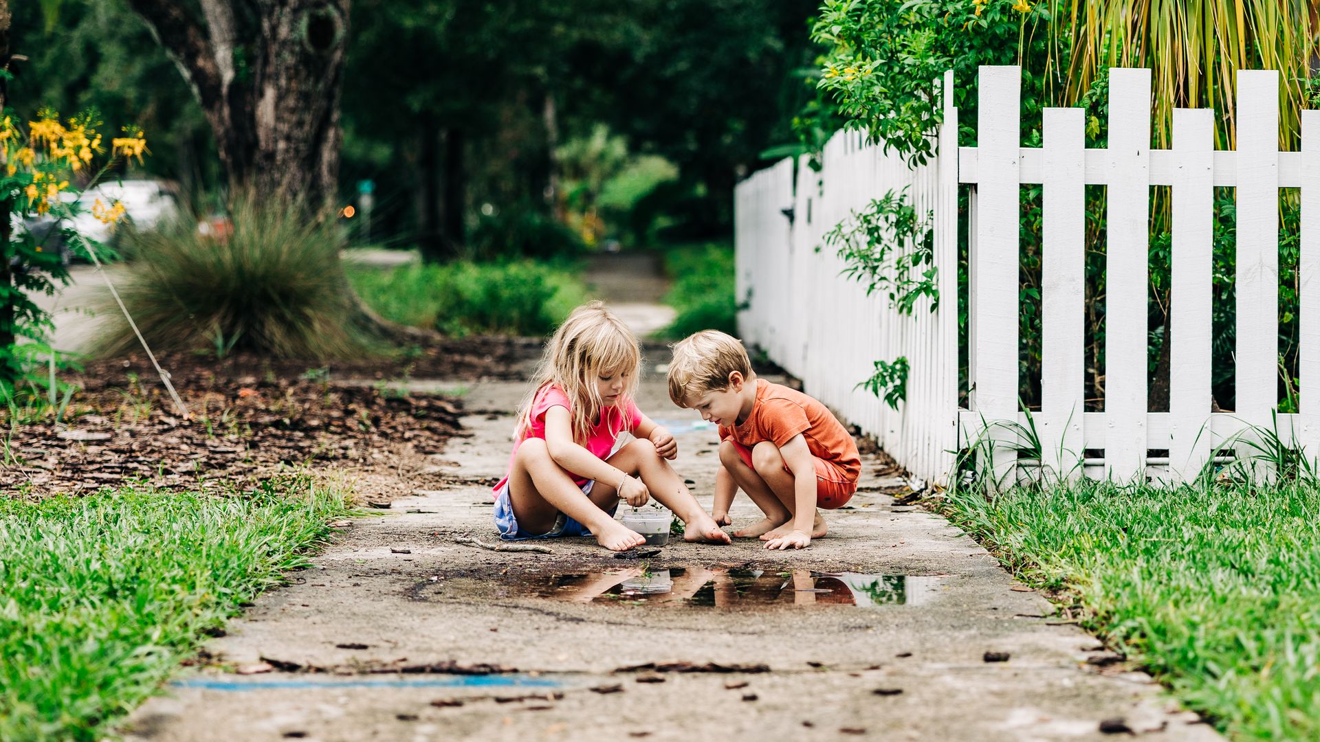 kids playing in a puddle