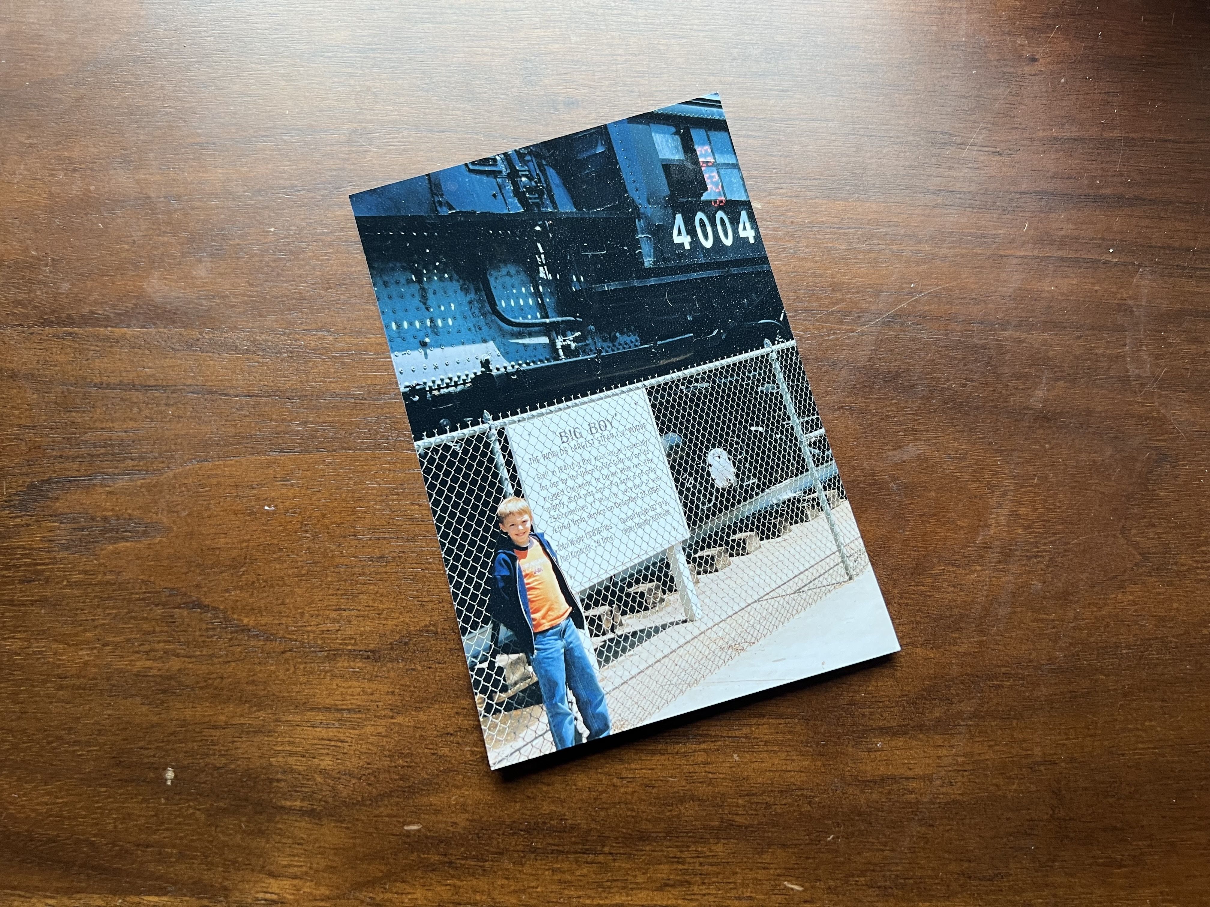 Jay Jordan as a child stands next to a Big Boy locomotive 