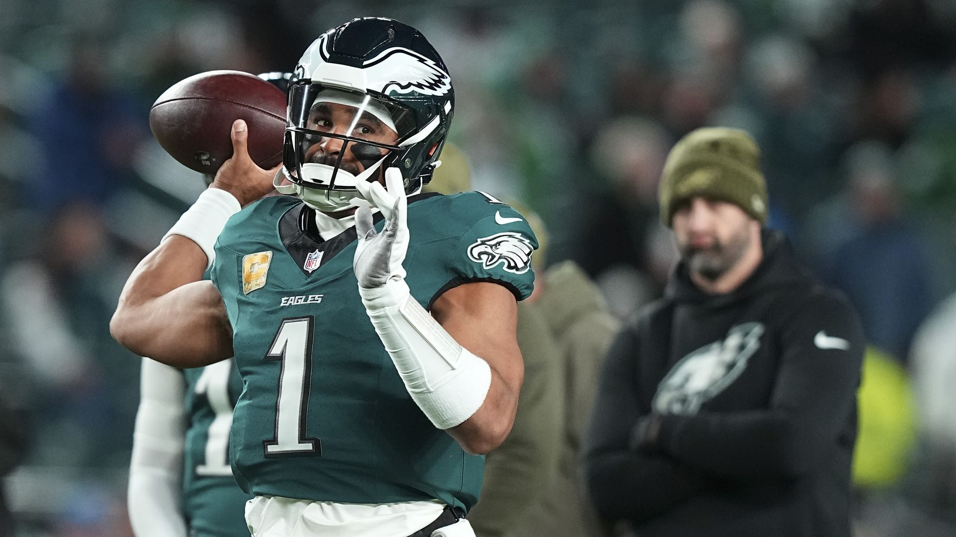 Jalen Hurts warms up as head coach Nick Sirianni looks on prior to the game against the Detroit Lions at Lincoln Financial Field in 2025.